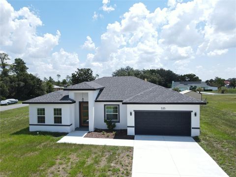Photo of 325 Marion Oaks Golf Way, Ocala, FL 34473 (MLS # O6277916)