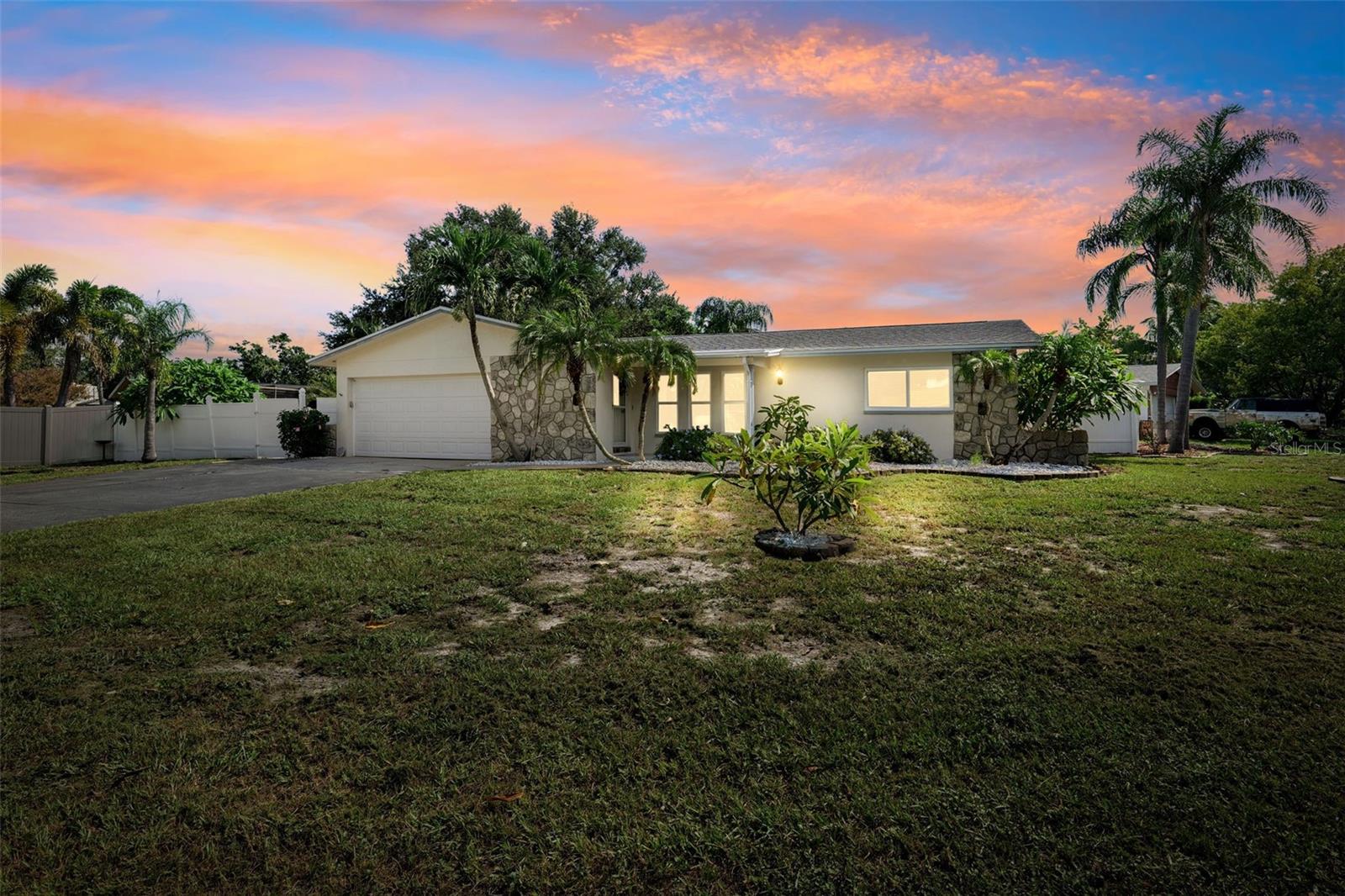 Call the moving truck! This home is ready to be yours! Step inside this completely remodeled 3 bedroom, 2 bathroom, 2 car garage, pool home on an oversized 0.30 acre corner lot lot tucked in the heart of Seminole, Florida. No stone has been left unturned when updating this gorgeous split floor plan home. Keep peace of mind with big ticket items done like a New Roof 2025, New Hurricane Impact Windows and Slider 2025, HVAC 2019, water heater 2022. You’ll instantly enjoy the spacious living room and luxury vinyl floors throughout, installed in 2025. A large dining space off the kitchen and flex space in the back of the home allow plenty of room for enjoyment by everyone. The large primary suite includes a walk in closet and ensuite bathroom, with easy access to laundry. Both the primary and guest bathroom have been renovated in 2025. The beautiful kitchen and breakfast bar includes new cabinets, new granite countertops, and brand new Whirlpool and Frigidaire appliances, all in 2025. Enjoy peaceful mornings or fun summer nights on the covered patio overlooking the pool and large backyard. Low restrictions allow nightly rentals. Plenty of room in the yard and driveway for boats, RVs and extra parking. Don’t miss the amazing location: less than 2 miles to local beaches, 1/2 mile to grocery store and local eateries, and a quick 30-40 minute ride to both local airports! Schedule your showing today!