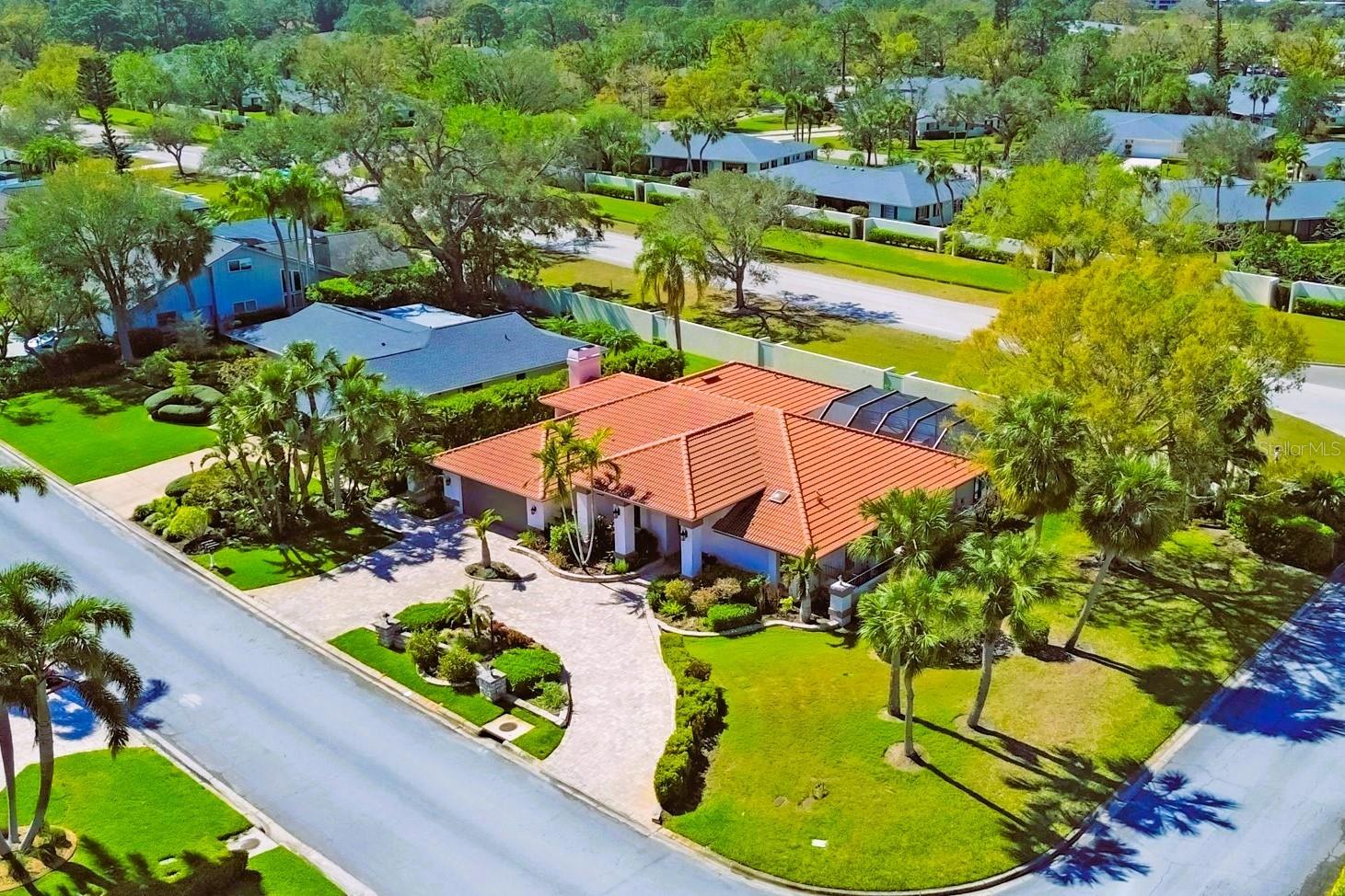 MORE BANG FOR THE BUCK HERE - This is now the home with the BEST PRICE by size in the always-popular, PALM AIRE COUNTRY CLUB! Come see this beautiful and spacious 3 bedroom, 2 bath, home located in the highly sought after Country Lakes subdivision, only 1 mile from the club or golf. Spread out here with the best of both worlds here with a Great Room AND Family Room. The open floor plan is great for entertaining... or just living! The Great Room is off the Kitchen and features Vaulted Ceilings, a Wood-burning fireplace and Wet Bar. A wine fridge too! The Breakfast Nook has sliders that open to the oversized Lanai. Of course, the Lanai is where your large, In-ground, Heated and Caged Pool awaits. This area also includes an outdoor shower, convenient sink with counter space, and plenty of R-O-O-M for outdoor gatherings. Back inside, updates abound. (Keep in mind that this home has been lightly used by these owners as a second home.) All interior lighting, electrical switches, vents and outlet covers have been replaced. The closet doors throughout the home are all new. Over the last 3-4 years the flooring in both bathrooms, the Dining room and Game room have been replaced with 'Lifeproof' flooring. the Kitchen has been updated with Wood Cabinetry and Granite Counters. Nearby, the Palm Aire Country Club offers a variety of optional Equity Memberships including Full Equity, Tennis Equity, Social Equity and Sports Equity. Pleanty of fun, active and healthy things to do around here with lots of other active, fun-loving members. Palm Aire is conveniently located just a few minutes from The Mall at University Town Center, an extensive selection of dining and shopping options, as well as the world-class Benderson Park and Rowing Facility. And don't forget that the energy, culture, and nightlife of Sarasota is just a short ride away. Did I forget to mention the award-winning beaches of Siesta Key? The Lido Key beaches and St. Armands Circle have regularly-scheduled events too! Lastly, you'll appreciate the convenience of top-rated medical facilities if needed, and our recently-expanded, Sarasota-Baradenton International Airport. You'll be glad to know that this home has been well-maintained by the current and previous owners: A new Tile roof was added in 2017, the classic Circular driveway redone with upgraded Paver bricks, new Hurricane-rated windows, doors, and Garage door added, the Pool heater and pump are new, and a new Water-softening system installed. Nothing left to do here but unpack start enjoying it all!