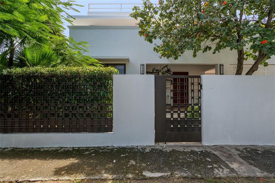 A Zen paradise in the gated beach community of Santa Teresita, San Juan. Perched in a coveted location with sweeping views of Ocean Park Beach and El Yunque, this 4-bedroom, 4-bathroom residence on Calle General Patton is an extremely rare find that seamlessly combines modern design and sustainability. From its soaring 12-foot ceilings and hurricane-proof windows, to its state-of-the-art solar panel system, every detail has been thoughtfully curated to provide sleek beauty and peace of mind. Its abundance of natural light feels open and inviting. 

The kitchen is designed for both function and sophistication, featuring rich wood cabinetry, stainless-steel appliances including a dishwasher, a Monogram wine fridge, and the capability to install a gas-powered stove. The primary suite includes a spacious en-suite bathroom, while the additional bedrooms offer flexibility for guests, family, or to create an office space. Ample storage throughout the home enhances its practicality. For added security and efficiency, the home is equipped with a gas generator, a Sol-Ark solar panel system, and three Revolt band batteries to store energy, ensuring ultimate comfort.

The outdoor living space is truly an entertainer’s dream, highlighted by a marble-top patio with a built-in grill, kitchen sink and full outdoor bathroom. Yet more entertaining space, or potential living space, is available upstairs. The rooftop offers incredible potential to build an additional level and expand the panoramic views of the ocean and El Yunque mountains. The property is equipped with a sub pump for added protection, yet it remains safely outside of a flood zone on a non-flooding street. 

This home presents a rare chance to live or invest in a property that blends luxury finishes, sustainable energy solutions, and unmatched potential in a prime beach location. The property is being sold with professional remodeling plans, giving buyers the opportunity to further customize and elevate the space to their vision. 

Mere steps from the beach and the newly renovated Barbosa Park, featuring full track, soccer fields, work out stations, basketball, tennis, and pickleball courts, this location is perfect for fitness and water sports enthusiasts. Near the trendiest bars and restaurants on Calle Loiza, this location truly offers something for everyone. Do not miss this opportunity, call for more information.