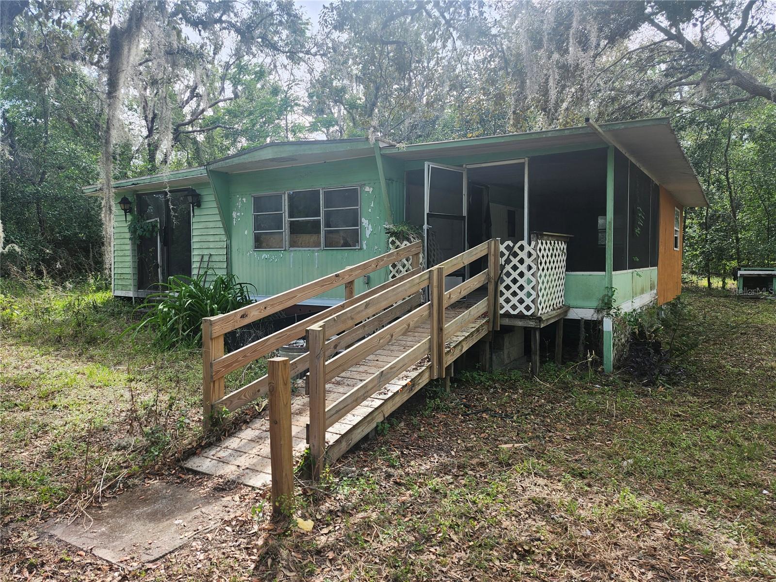 Very rough single wide with additions. Roof Leaking in at least 2 places. Electric Bad. Home needs to be rewired. Drywall unfinished. Kitchen is minimal. No appliances. Floors surprisingly solidlike. No bad smell. Weird second bathroom with no tub or wall. Nice 1/4 of an acre. Cheapest property in Moon Lake at time of listing. 1971 Mobile according to county record. NO DEED Restrictions. No Pet restrictions. No lease restrictions. No Flood Insurance. Cash only due to condition. Zoned agricultural bring the chickens. As home needs to be rewired, power will not be turned on for inspections. Financing available with 30 per cent down.