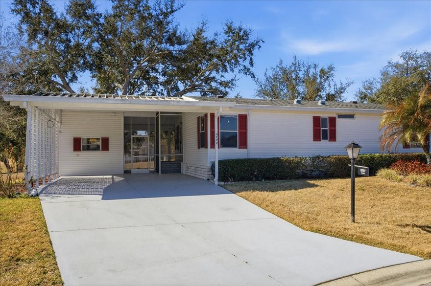 WHITE WALLS IN KITCHEN AND BEDROOM COMING SOON. PICTURES ARE VIRTUALLY PAINED WHITE, CURRENT COLORS ARE ALSO ATTACHED. This well maintained 2/2 on a quiet cul-de-sac is waiting for your personal touches. Desirable Double Carport, Screen Room and Storage Area face open space with no close neighbors. NEW ROOF 2021, 18x11 Heated/AC Florida Room addition not in recorded square footage, provides lots of options for additional living space. PETS APPROVED.  Zellwood Station is a Resident Owned 55+ Golfing Community located between Apopka and Mt Dora. We have a 72 Par golf course, 4 pools, pickleball and tennis courts; water exercise and line dancing classes and our own Whistle Stop Restaurant and Lounge with banquet facilities. There is always something to do here. Close to the 429 for easy access to airports and attractions, we are close to shopping, restaurants, medical facilities and churches. Come and see what we have to offer!
