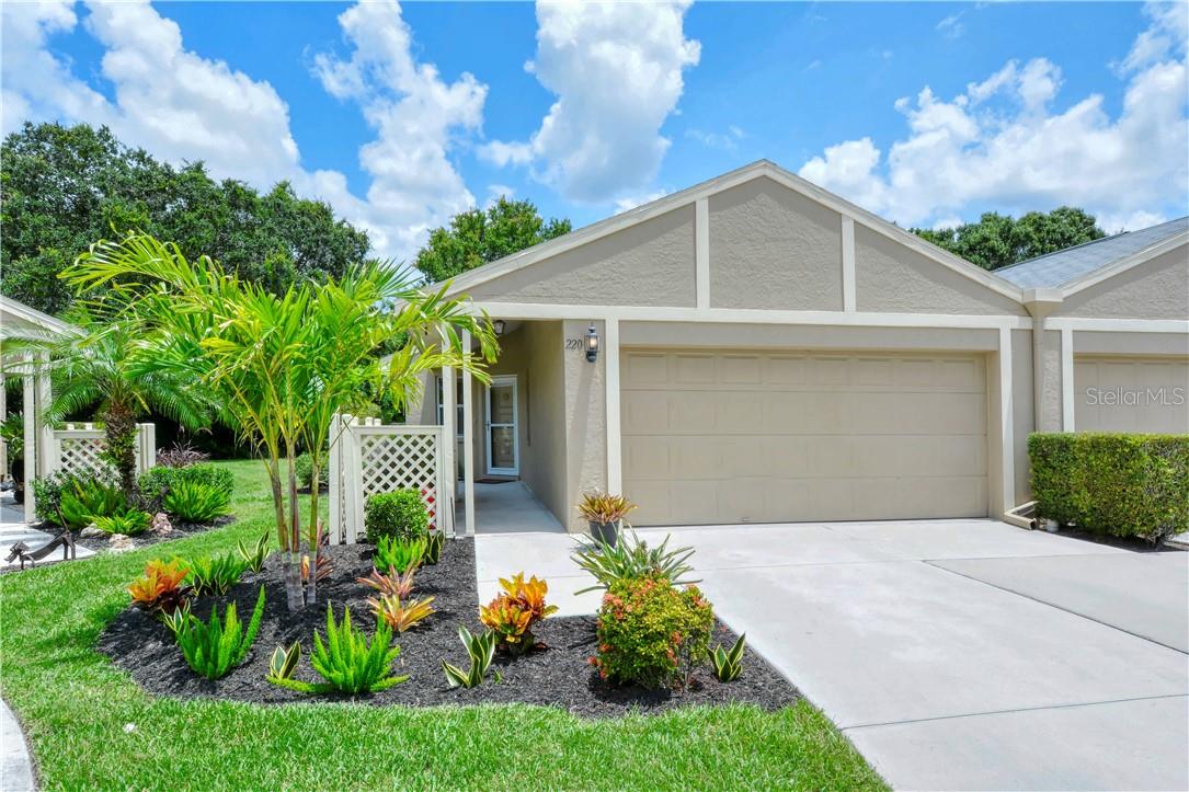 JUST MINUTES FROM DOWNTOWN SARASOTA, THIS VILLA COMBINES COMFORT, CONVENIENCE, AND TRANQUILITY! Perfectly situated, this centrally located home boasts two bedrooms and two bathrooms, each with its own spacious walk-in closet. Highlights include soaring vaulted ceilings, a bright kitchen with breakfast area, two car garage, brand-new flooring throughout, lovely community pool, and a freshly painted interior, offering a clean slate for your personal style.
The screened patio brings the outdoors in and provides a peaceful space for morning coffee or quiet reflection. The villa also features an enclosed atrium filling the space with natural light.
Tucked away in a peaceful neighborhood, yet only minutes from downtown Sarasota, I-75, top dining, entertainment, and the stunning Bayfront, this charming villa offers both easy access to the city's vibrant scene and a serene retreat to call your own.
Don’t miss the chance to view this villa located in McIntosh Meadows at 220 Chartley Court North.