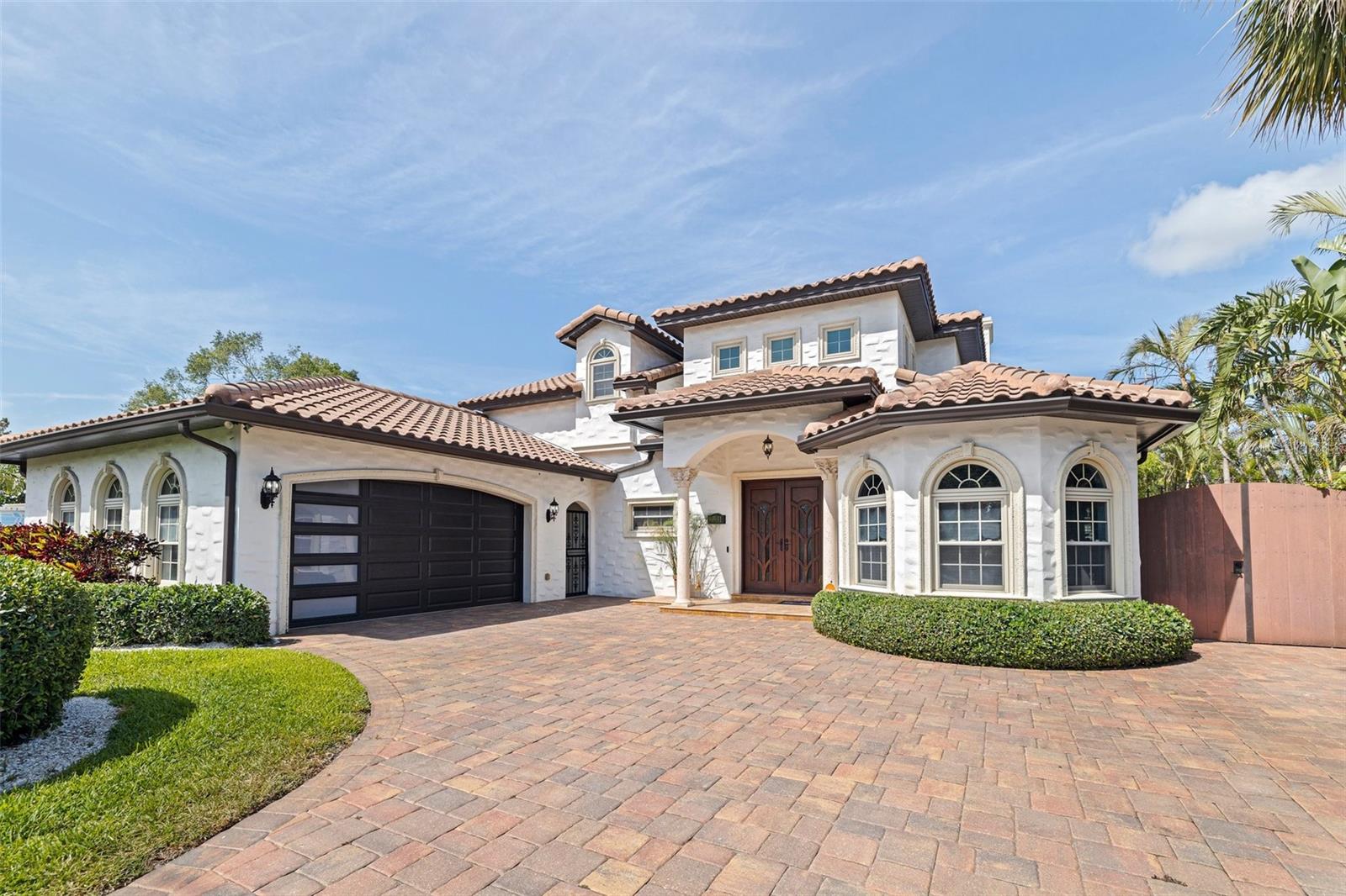 Available 8/1/2025 - 30 days minimum; 3 months+ preferred.
Enjoy your winter in this custom Spanish-Mediterranean style, waterfront home conveniently located just 2.5 miles from Downtown St. Pete and nestled on
“The Friendly Island” of Coquina Key. Completed in 2012, this breathtaking 2-story, 3,366 sq/ft home with 3 beds, 3 baths & oversized 2-car
garage, is sure to define luxury waterfront living. Featuring an open floor plan and 20’ ceilings in the entryway foyer, as you step inside you will
be captivated by the openness of the home and unobstructed water views straight through the living quarters. Be sure to notice the added beauty
of crown molding, travertine tile and wood plank flooring, a built-in dog space under the stairs, wood burning fireplace and many other custom
finishes that make this home one-of-a-kind! The kitchen is a chef’s dream with top-of-the-line Miele appliances, a built-in barista station, dual
pantry/storage, custom cabinetry, direct access to the formal dining room and is the center of the home making entertaining a breeze. The rest of
the 1st floor includes a guest room & bath; private breezeway access to your breakfast room & garage; and the unmatched primary suite that
boasts double sliders to the pool and a massive en-suite with double walk-in closets, soaking tub, dual vanity, water closet, and oversized walk-in
shower with two rain showerheads and numerous body jets. Head upstairs to your 2nd en-suite that features a flex space/game room, stunning
bathroom and access to your 2nd floor balcony that is within the screened enclosure overlooking the pool and dazzling waterways. Adjacent, the
upstairs is complete with an additional oversized living area with added space for an office area and dual-sliders to the 2nd floor balcony, perfect
for sipping morning coffee or enjoying an evening cocktail. And for the standout exterior, this property features all fresh landscaping and shell
beds, a custom paver driveway, paver patio with built-in fire pit overlooking the waterway and pool, private dock with boat & PWC lift, and the
unparalleled 2-story screened enclosure that houses your heated pool and spa. This pool is an entertainment highlight with an expansive
travertine tile pool deck, dining areas, multiple lounging spaces and endless opportunity for fun in the sun, all just steps from the beautiful
intercoastal waters and the Gulf! Aiding in efficiency, this home is equipped with solar panels, a barrel tile roof, all impact sliders and windows,
and in 2024 a new propane pool heater & equipment installed. With the common goal of creating a community that makes all its residents proud,
Coquina Key is home to parks & playgrounds, pickleball, basketball and tennis courts, a soccer/football field, miles of walking trails, 2 dog parks
and more! This neighborhood makes staying active enjoyable for you, your family, and/or pets! Between the high-end custom finishes and
unmatched luxuries of the outdoor living spaces, this home speaks for itself in providing endless opportunity for the highly sought after waterfront
lifestyle on the sparking waters of St. Petersburg, FL! Short term or long term rentals are offered at tiered monthly rates.