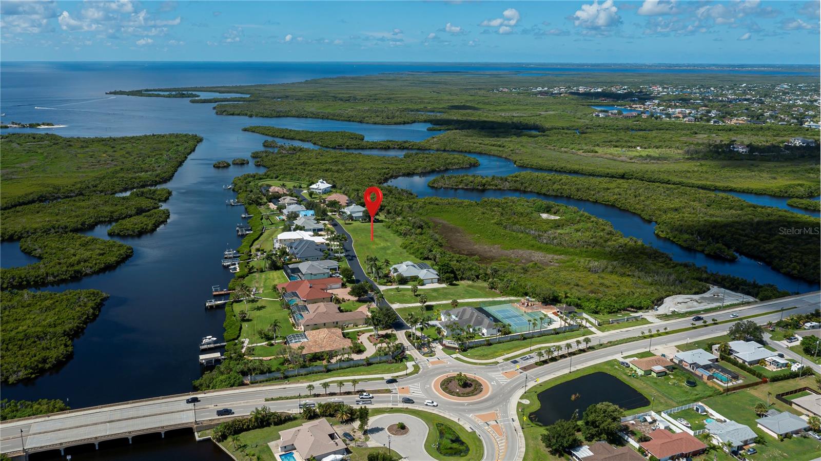 Fabulous opportunity to own this fabulous oversized lot in unique Lea Marie Island. This unique community is located approximately 1/2 mile to Charlotte Harbors open waters leading to Boca Grand and the Gulf of America. Talk about location this is location. There are only 20 parcels in this community. The homes are custom built which makes for uniqueness. This lot features a little over a half an acre and comes with a deeded boat dock number 16. The community offers tennis court, basketball courts and more. We have builders available to build the home of your dreams