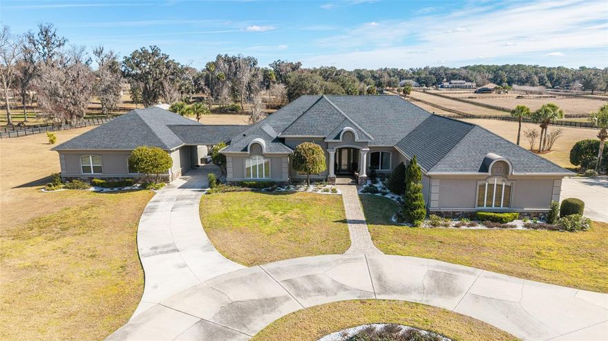 Stop the press!!  Huge Price reduction on this Exceptional equestrian-friendly estate located in the highly desirable Spring Grove community, just minutes from the Florida Horse Park and a short drive to the World Equestrian Center. Set on 6.67 fully fenced acres, this rare property offers the perfect blend of space, privacy, and versatility—ideal for horse enthusiasts, multigenerational living, or anyone seeking a peaceful country lifestyle with modern conveniences.

The 3,572 sq ft main residence features four spacious bedrooms plus a versatile flex room, perfect for a home office, studio, or additional guest space. Large sliding glass doors open to an expansive outdoor living area showcasing a resort-style pool and spa, outdoor kitchen, and sweeping views across your acreage—an ideal setting for relaxing after a day at the barn or hosting gatherings with family and friends.

A separate 1,099 sq ft guest house, newly built in 2019, offers two bedrooms and two full baths, full kitchen,  washer and dryer providing comfortable and private accommodations for extended family, caretakers, or long-term guests—perfect for true multigenerational living. The home has a newly built patio situated between the main house and in-law suite.  This a great place to sit  and relax at the end of the day. 

Garage and storage options are abundant with a two-car attached garage, an additional converted playroom/game room, and a detached three-car garage, offering exceptional flexibility for vehicles, equipment, trailers, or farm necessities.

Recent updates include a 2019 roof, whole-house generator, and central vacuum system, adding peace of mind and convenience.

With ample room to add barns, paddocks, or additional equestrian amenities, the property is ready for your personal vision. Riding trails surrounding the community allow you to saddle up and ride directly from home.

Offering unmatched proximity to world-class equestrian facilities while maintaining the serenity of country living, this one-of-a-kind estate presents a rare opportunity in an exceptional location.