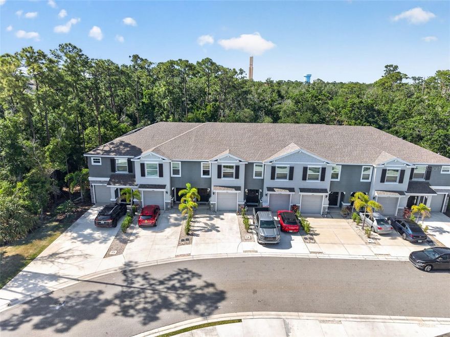 Welcome to the highly desirable Bay Landing community, where modern design meets effortless Florida living. Built in 2022, this beautifully maintained townhome with designer touches throughout features 3 bedrooms, 2.5 bathrooms, and an attached one-car garage—ideal for full-time residents or seasonal enjoyment. 

Step inside to a bright, open-concept floor plan designed for both everyday living and entertaining. The spacious kitchen is a standout, complete with granite countertops, stainless steel appliances, a generous pantry, and a stainless appliances. The living and dining areas flow seamlessly to a screened-in lanai—where this home truly shines—overlooking a private, wooded backdrop that offers a rare sense of peace and privacy not often found in the community. It’s the perfect setting for relaxing mornings or quiet evenings.

Upstairs, the oversized primary suite serves as a peaceful retreat with a large walk-in closet and en-suite bath. Two additional bedrooms and a full bath offer flexibility for family, guests, or a home office.

Built for durability and peace of mind, this home features all concrete block construction with quality craftsmanship. Bay Landing is a maintenance-free community with no CDD fees and low HOA fees, offering resort-style amenities including a clubhouse, sparkling swimming pool, fitness center, tot-lot, and dog park.

Ideally located just minutes to I-75 for easy commutes along with close convenience to UTC, Waterside, downtown Sarasota, and world-renowned Gulf Coast beaches, this home delivers the perfect combination of comfort, great location and the ultimate Florida lifestyle—enhanced by one of the most private and serene settings in the neighborhood.