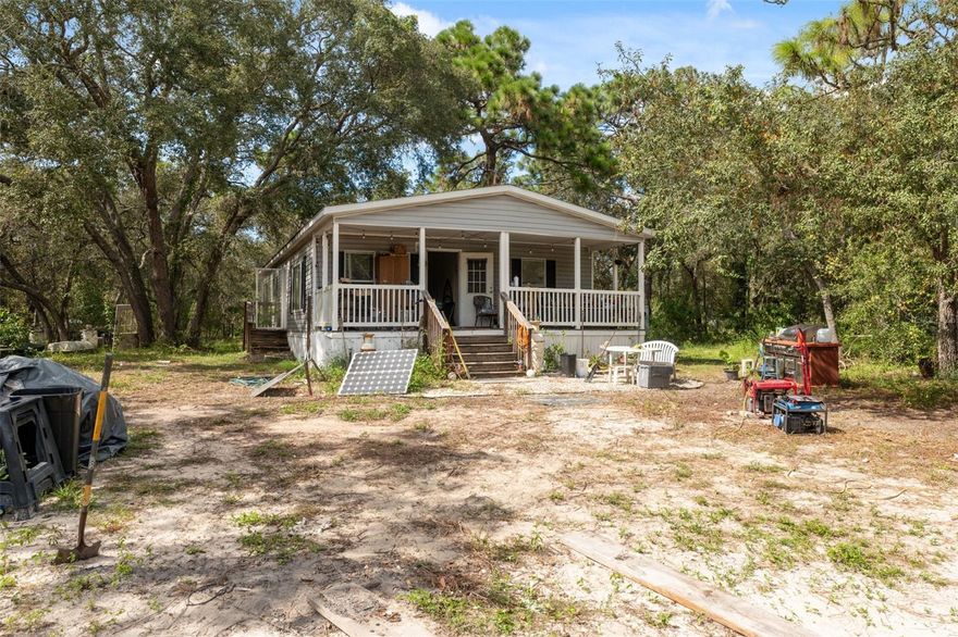 One or more photo(s) has been virtually staged. Sitting on approximately 2 ACRES, this 3-bedroom, 2-bath, fixer upper is full of potential! With 1,296 square feet of living space, the open floor plan offers flexibility for whatever you envision, whether you’re looking for a personal residence, an investment, or your next flip. The primary suite is spacious with its own private bath, and the split floor plan provides extra privacy. Outside, you’ll find plenty of mature trees, AR zoning, and no HOA or CDD fees! Bring your animals, your toys, and all your ideas to make this property your own. *Please do not go on the property without an appointment!
