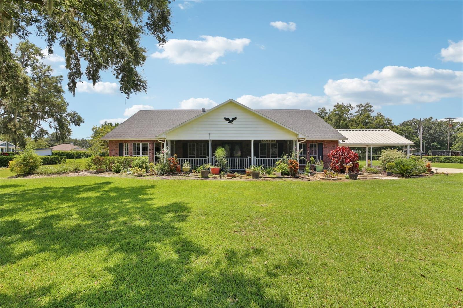 One or more photo(s) has been virtually staged. Welcome to your dream home in one of the most desirable locations!
This spacious single-level residence sits on 2+ acres of beautifully landscaped, high-and-dry land, offering privacy, versatility, and room to grow. The property includes a large workshop with two roll-up garage doors—perfect for hobbies, storage, or even converting into a guest apartment or in-law suite.
Zoned AS-1, no HOA with double lot allows for additional homes, mobile homes, or multi-generational living options. The entire property is fully fenced with an automatic gate, providing security and plenty of space for pets and children to play freely.
Inside, you'll find a chef’s kitchen featuring a center island, granite countertops, custom lighting, cooktop, wall oven, trash compactor, and a large stainless steel refrigerator. The home showcases oversized bedrooms and two spacious living rooms that can easily be transformed into offices, bonus rooms, or extra bedrooms to suit your needs.
The master suite is a true retreat with two walk-in closets, a built-in floor safe, a luxurious garden tub & dual sinks. It also connects to an additional living space that was previously used as a private suite—ideal for multi-family living.
Additional highlights include:
Roof replaced 2017 *
Two AC systems with humidity control *
5 "Fandaliers" *
Plantation shutters *
Security Cameras outside are included *
gutters around the home *
Oversized garage with outdoor shower, sink, and screen door *
Attached 2-car carport and extra parking pad *
Deep well with water softener/treatment system *
Recently serviced septic system *
Wood-look tile flooring, wood-burning fireplace, tubular skylights *
Screened front and back porches *
Fabric and aluminum awnings and window coverings *
Located in the sought-after 33565 zip code, this home offers top-rated schools and quick access to I-4 for easy commuting to Tampa or Orlando. Plus, you're less than a mile from Keel Farms Winery!
Farm animals are welcome, and the property is move-in ready for its next family to enjoy. Homes like this don’t last long—schedule your private tour today!