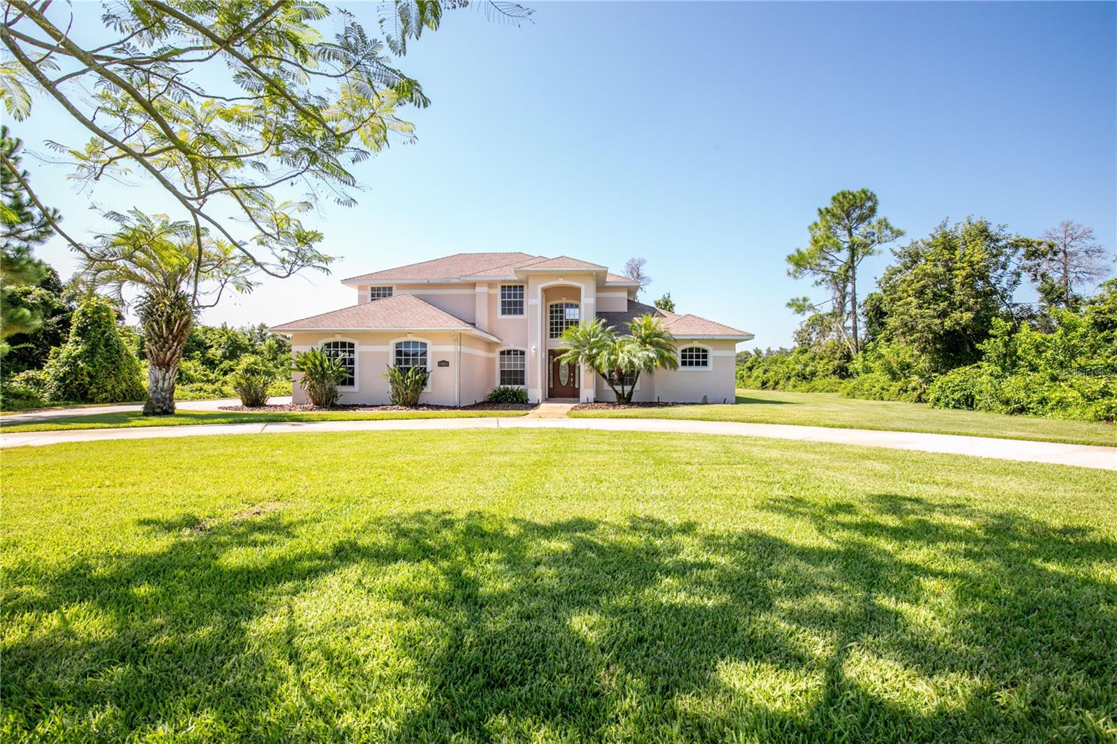 One or more photo(s) has been virtually staged. STUNNING REMODELED HOME ON ONE ACRE WITH LUXURY UPGRADES! Welcome to your private retreat--this beautifully remodeled (in 2023) residence sits on a full ONE ACRE-LOT and offers the perfect blend of modern comfort and serene outdoor living. Step into the gourmet kitchen featuring CAFE' APPLIANCES, DOUBLE OVEN WITH GAS BURNERS AND ELECTRIC OVEN, GLEAMING QUARTZ COUNTER TOPS, and custom SOFT CLOSE CABINETS. The layout with spacious living areas is filled with natural lightning. The primary bedroom suite is a spa-like sanctury, complete with a luxurious WALK-IN-TUB. Guests bedrooms are upstairs giving you and them privacy. Enjoy endless summer days in the SALT-WATER POOL, surronded by lush landscaping and plenty of room for entertaining. This home also features FULL HOME GENERATOR, PEST CONTROL WALL SYSTEM giving you peace of mind. Located in between Tavares and Mount Dora gives you quick access to all the shops and restaurants. PLEASE SEE ATTACHED FEATURES AND BENEFITS FOR MORE DETAILS AND UPGRADES. Dont miss the opportunity to own this extraordinary home!!
