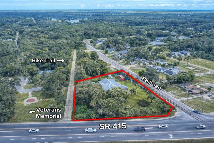 HIGH-EXPOSURE RESIDENTIAL / COMMERCIAL CORNER – OSTEEN GROWTH CORRIDOR
Strategically positioned 1.09-acre corner lot with triple road frontage, including SR 415, delivering maximum visibility, accessibility, and long-term upside.
Located in the core of Osteen, next to the Osteen Trailhead and directly in the path of growth, part of the future Osteen Commercial Village, this site is primed for commercial expansion and increasing demand.
Flexible zoning supports multiple income-producing uses: retail, QSR/fast food, contractor operations, storage, and service businesses.
Existing improvements add immediate value:
• Main structure with solid bones ready for renovation or repurposing 
• Corner building with historic character, ideal for office, retail, or specialty use 
Ideal for investors, owner-users, or developers seeking a high-visibility site with redevelopment potential and future appreciation.
Available for SALE or LEASE – strong opportunity to secure a key position in Osteen’s commercial expansion.