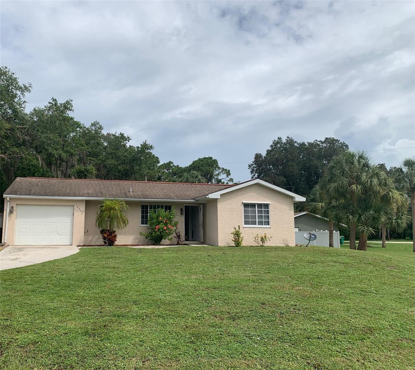 Right in the heart of Port Charlotte, here is the perfect place to call home. With immediate availability, start packing your bags today. Situated on an oversized corner lot, with a fenced back yard, plenty of room for the kiddos to play catch with the Pup. Tile and laminate flooring keep the house cool, clean and provide a modern aesthetic. The kitchen has been updated which will please the cook in the family. The lanai is fully enclosed and provides extra living space. Park the car in the attached garage and avoid bringing the groceries inside in the rain. Please call for showing details.