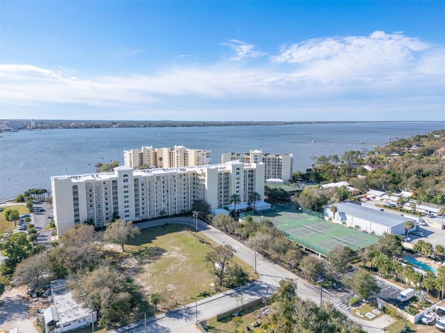 Discover this stunning 4th-floor condo with breathtaking DIRECT INDIAN RIVER VIEWS in the exclusive gated Island Pointe community! This former model unit presents 2,275 sq ft of refined living with 3 generously-sized bedrooms, 2 updated bathrooms with custom hand-painted tiles, and a welcoming family room. Enhancements include brand-new AC (2023), roof (2024), custom built-in display cabinetry, elegant wood and tile flooring throughout, expansive closets, and electric storm shutters. The spacious balcony patio offers remarkable rocket launch & wildlife views—watch the dolphins and manatees! Resort-style amenities feature two heated pools, two tennis courts, pickle-ball, clubhouse, fitness center, spa, and sauna. Ideally located near Historic Cocoa Village shopping, renowned beaches, Port Canaveral, and the Kennedy Space Center. Convenient access to I-95 and Highway 528 links you to Orlando attractions, airports, and Space Coast destinations.

The Island Pointe Condominium Association monthly fees offer exceptional value, covering water (hot and cold), sewer, garbage, basic Spectrum cable, pest control, and 24-hour security gate with guard. Enjoy unlimited access to two community heated swimming pools and Jacuzzis, plus a fully-equipped clubhouse with meeting area, media room, exercise room, dry sauna, and large kitchen. The association maintains and cleans all common areas, lobbies, clubhouse, pool areas, and exercise facilities while also providing elevator maintenance, fire alarm monitoring, dryer vent cleaning, and car wash access. All exterior maintenance is included, grounds, lawn care, landscaping, trees, sprinkler systems, driveway resurfacing, pressure washing, and building painting, ensuring a truly carefree lifestyle. Your tropical retreat awaits!
