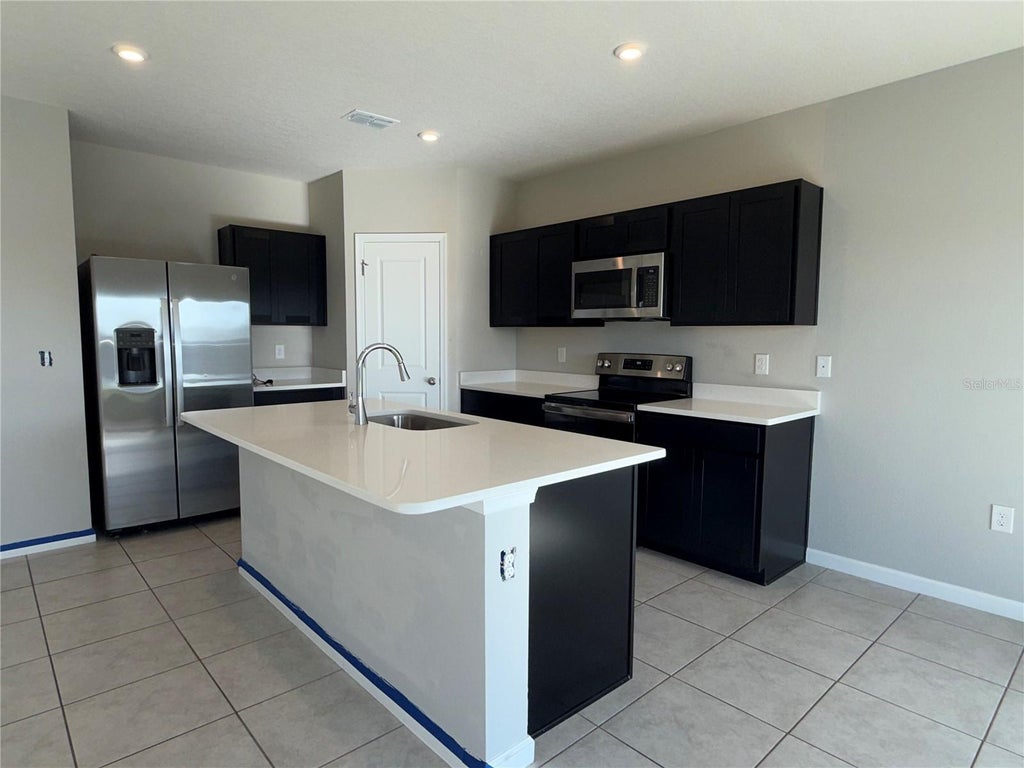Photo of 1109 Lexington Lane, Haines City, FL 33844 (MLS # O6433009)