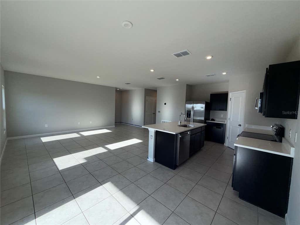 Photo of 1109 Lexington Lane, Haines City, FL 33844 (MLS # O6433009)