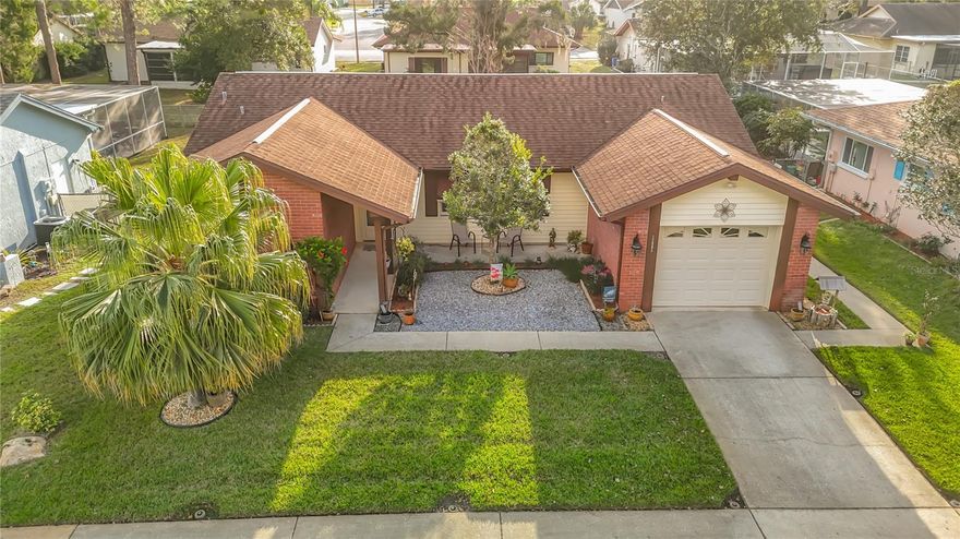 Charming 2 Bedrooms | 2 Bathrooms | Energy efficient Home. Welcome to your new sanctuary! This adorable two-bedroom, two-bath home perfectly blends cozy living with incredible outdoor entertainment possibilities and modern energy efficiency. Enjoy the convenience of newer appliances throughout the home, including a high-quality washer and dryer and a brand-new hot water heater. Significant investments have also been made to ensure maximum comfort and minimum utility costs, including new HVAC & Ductwork and solar panels to significantly reduce electricity bills.  Enjoy peace of mind and consistent temperatures year-round with a these recent updates. A Private Water Well is available specifically for watering the lawn, keeping your landscaping lush without driving up your municipal water bill. The beautiful courtyard is the heart of this home, featuring lush, manicured landscaping that creates a serene atmosphere. Hosting a weekend barbecue or unwinding after a long day, is easy with the dedicated outdoor living space. Whether you're Relaxing in the cozy private spa or Enjoying the complete outdoor dining area and grilling station, this home is the perfect spot for any gathering. Discover the charm of Beacon Woods East! A designated Bird Sanctuary, perfect for nature lovers, this neighborhood features ample sidewalks, a huge saltwater community pool, and tennis courts.  Conveniently located minutes from top schools, hospitals, and shopping, and just a short drive via Suncoast Pkwy to Tampa Airport and world-class beaches. Come see why this is the perfect place to call home!  NO FLOOD ZONE! This property is located outside of designated flood zones, providing safety and potential insurance savings. LOW HOA FEES! Enjoy extensive community amenities without the high cost, making for an affordable lifestyle. Don't miss the opportunity to own this efficient, relaxation-ready home. Schedule your private tour today!