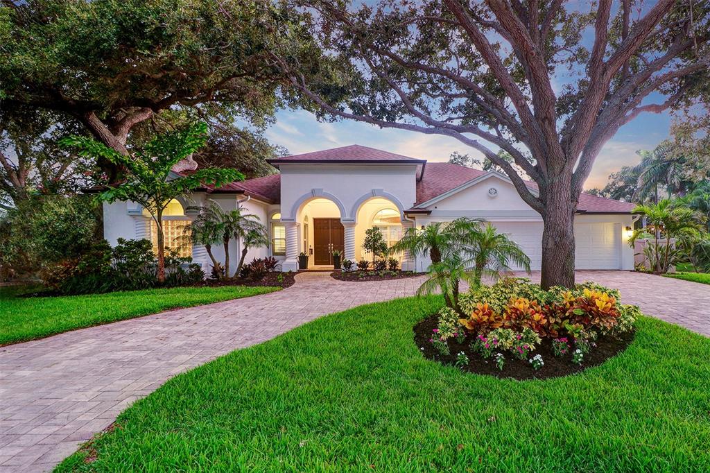 Immaculate St. Petersburg gem! Escape to your very own entertainers paradise in this "better than new" 4 bedroom, 3 bath, 3 car garage pool home, located in the premier waterfront community of Snell Isle. This jewel of a home has tremendous curb appeal highlighted by a circular driveway with mature landscaping, majestic oak trees, an inviting front porch and is situated on an oversized corner lot. Enter through the front doors into a warm inviting home that seamlessly blends superior craftsmanship, energy efficiency, and comfort. The homes open concept kitchen & great room combined with high ceilings and large windows are perfect for entertaining overlooking the covered outdoor kitchen & bar area and heated in-ground pool & spa. Convenient one level living floor plan provides for a private owners retreat complete with his & her walk in closets, a luxurious bathroom with dual vanities and large walk in shower with dual shower heads. Three additional bedrooms are spacious and located on the opposite side of the home. Enhance your overall lifestyle in the large bonus room which can be a game room, yoga room, music studio, gym or large office. This home has something for everyone and is located only a short walk from vibrant downtown St Petersburg where you can enjoy fine dining, shopping boutiques, visit museums and art galleries.
