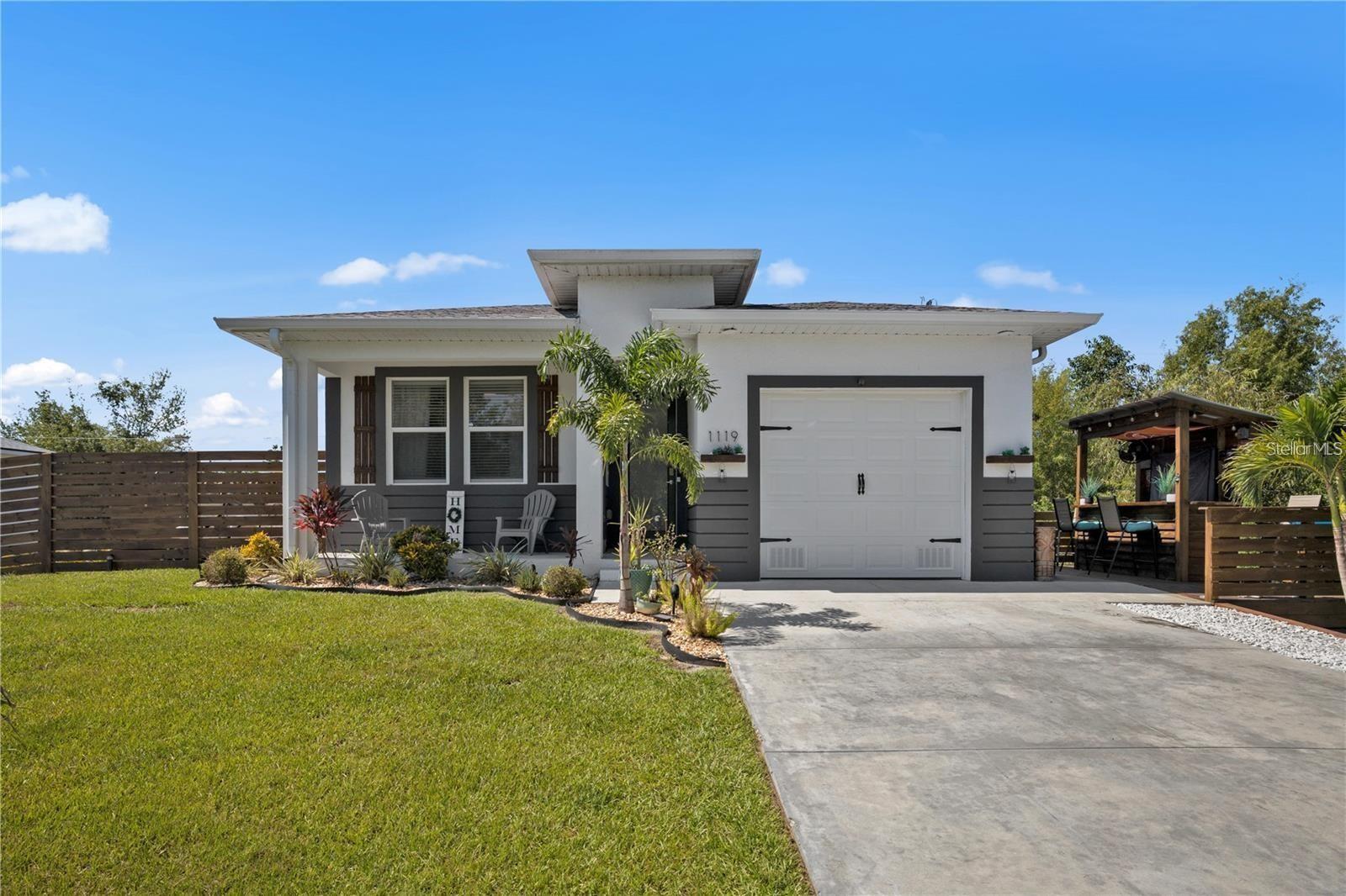 Welcome to your slice of Florida paradise! This stunning 2020-built home is practically brand-new, freshly painted inside, and move-in ready. This 3-bedroom, 2-bathroom pool home offers 1,338 square feet of modern charm, complete with three outdoor decks/patios—perfect for entertaining, soaking up the sun, or savoring those gorgeous sunrises and sunsets. As you step inside, you’re greeted by an 8 ft frosted glass hurricane-impact door with key code entry for effortless access. The home boasts oversized tile flooring, 10 ft ceilings, and an abundance of natural light pouring through hurricane-impact windows, creating a bright and inviting vibe that flows seamlessly throughout. The open-concept living area, with recessed lighting, is ideal for both cozy nights in and lively gatherings. The sleek, modern kitchen is a chef’s dream, featuring stainless-steel appliances, custom cabinetry, quartz countertops, and a breakfast bar with ample counter space for all your culinary creations. Escape to the tranquil primary suite, complete with a custom accent wall, walk-in closet, and a luxurious ensuite bathroom with custom tile, floating vanity cabinets, and direct access to your private backyard oasis. The two additional bedrooms, each with their own custom accent walls, are perfect for family, guests, or a home office. Step outside to your personal retreat—a spacious back porch overlooking a sparkling above-ground pool, surrounded by a large deck that’s perfect for relaxing or hosting summer barbecues. The side deck, complete with a built-in sports bar, is the ultimate spot for sipping a cold drink or cheering on your favorite team under the Florida sun. Built to the latest elevation codes for year-round peace of mind, this home is located in the heart of vibrant Punta Gorda, just minutes from top-notch dining, shopping, and outdoor adventures. No HOA or Deed Restrictions.