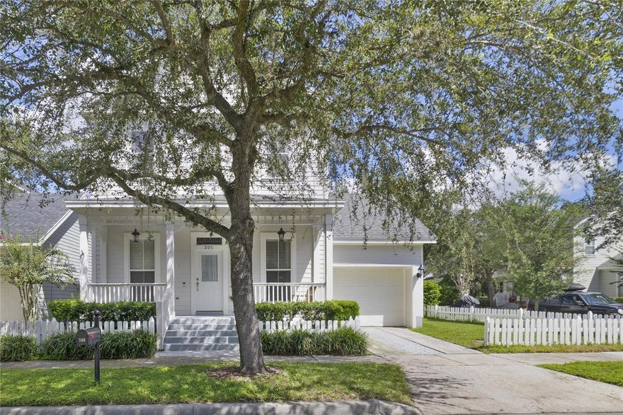 Welcome to 205 Ficus Street in the heart of Celebration North Village—a home that blends classic architecture with timeless curb appeal. Nestled on a charming tree-lined street, this residence greets you with a deep front porch framed by white columns, perfect for enjoying morning coffee or evening conversations with neighbors. Inside, the home features sunlit living spaces with large windows, warm hardwood flooring, and elegant crown molding that carries a sense of sophistication throughout. In addition to its 3 bedrooms and 2 and half baths, by the entrance you will find a conveniently located office space as well as an upstairs loft.

The kitchen is designed for both function and style, offering crisp cabinetry, granite countertops, stainless steel appliances, and a center island that opens to the dining and living areas—ideal for gatherings. Upstairs, the spacious owner’s suite boasts a walk-in closet and spa-like bath with double vanities, a soaking tub, and a separate glass shower. Additional bedrooms provide comfort and flexibility.

Outdoor living is just as inviting, with a private fenced yard and a side garage accessible from the front street, maintaining the community’s clean, picturesque streetscape.

Living in Celebration means more than just owning a home—it’s a lifestyle. Enjoy walkable access to neighborhood pools and parks, lakeside trails, vibrant downtown shops and dining, as well as top-rated schools.

205 Ficus Street offers the perfect balance of elegance, comfort, and community charm—ready to welcome its next homeowner.