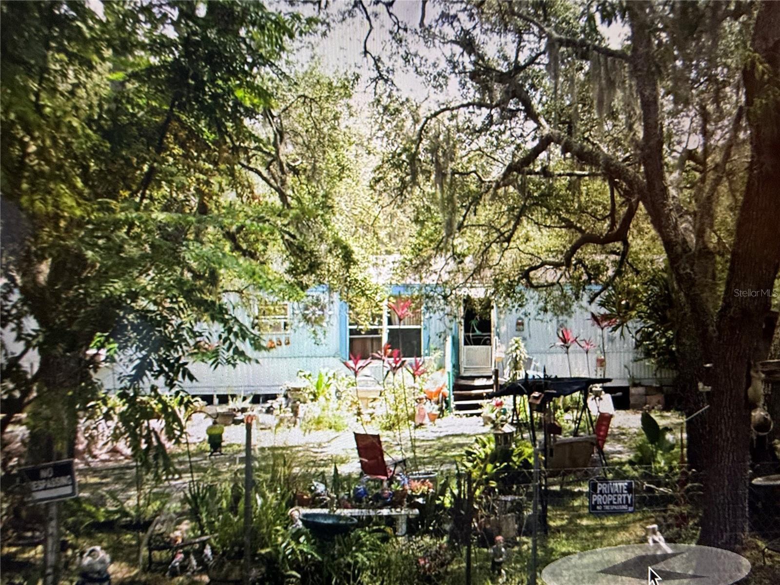 Come view this 1.33 Acre property with an inground Pool. Impact fees paid that saves $25,000 when building new house
or modular home on property. Inground pool needs some repair. Trailer is a 1997 3/2 with 1216 SF keep or remove needs work. Has detached shed/Workshop. Lots of potential in this property. Great location; 15 minutes from Parkway yet nice and quiet on a dead end road.