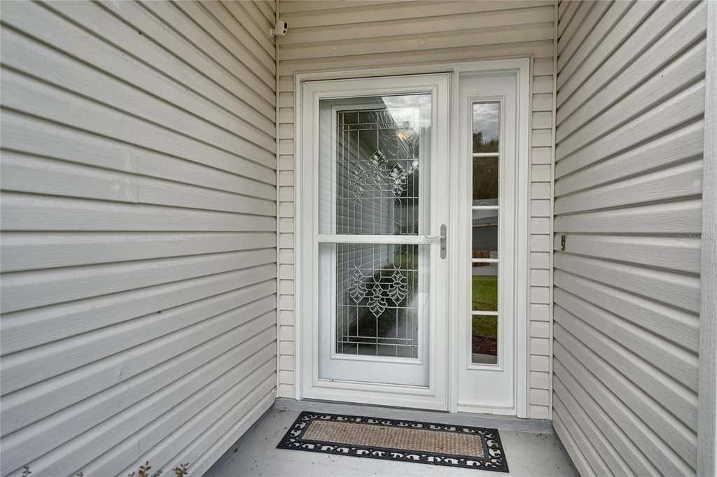 Photo of 25735 Glen Eagle Drive, Leesburg, FL 34748 (MLS # O6436929)