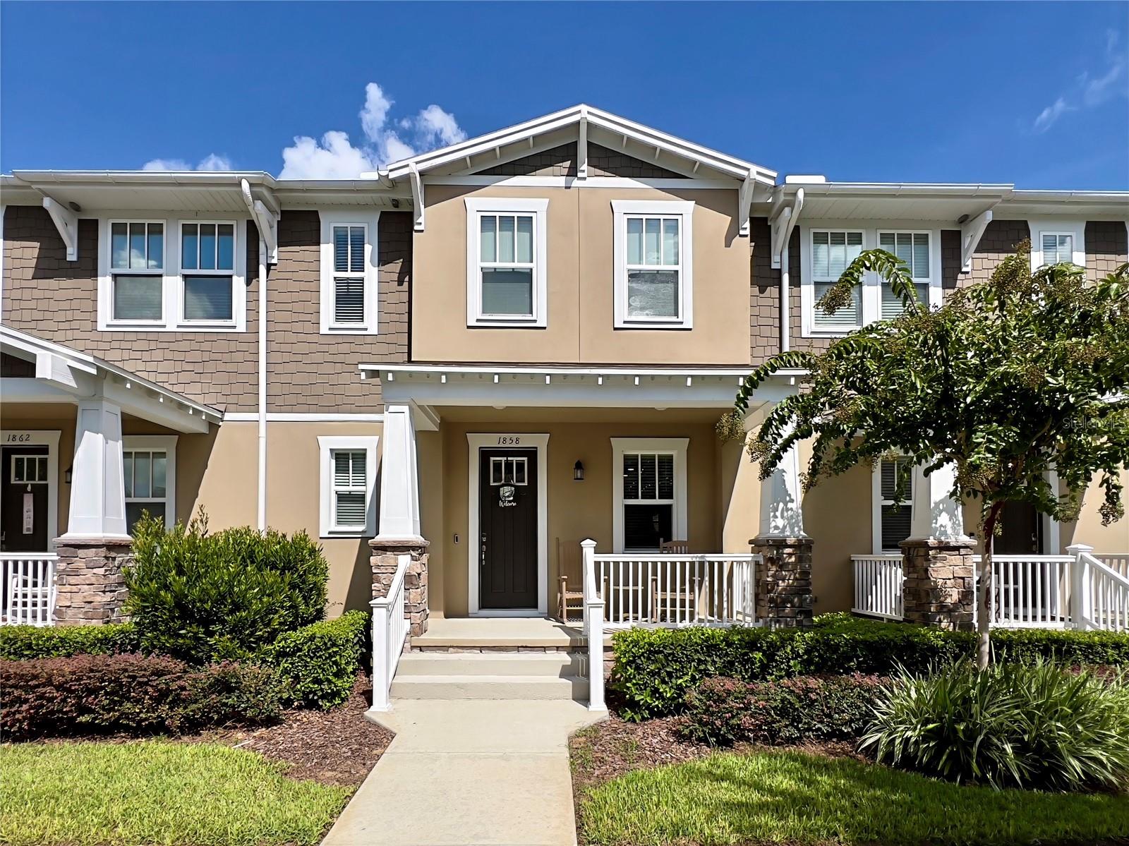 Welcome Home to this meticulously maintained townhome in Celebration's Island Village! Built in 2022, this 3 bedroom 2.5 bath is a stunning example of the beautiful craftmanship that Island Village has to offer. Upon entering the home, there is a generous living space and kitchen. The gourmet kitchen has stainless steel appliances and gorgeous stone countertops. This townhome comes equipped with a gas range- every chef's dream! There is space for a dining table as well as a half bath on this level. Upstairs you will fine three gorgeous bedrooms. The primary en-suite has dual sinks and stone countertops. The primary also has dual walk in closets. Bedrooms two and three have ample space and share a Jack and Jill full bath. The laundry is also located on the second floor for ease and convenience. This townhome also boasts a two car garage that comes with a Tesla car charger as well as a wall-mounted vacuum! All of the large screen televisions convey with the home as well. The home is located just a minute's walk from the beautiful Island Village pool, clubhouse and local restaurants, which makes this Florida lifestyle easy to access! This townhome has so much to offer and will not disappoint. Schedule your showing today!