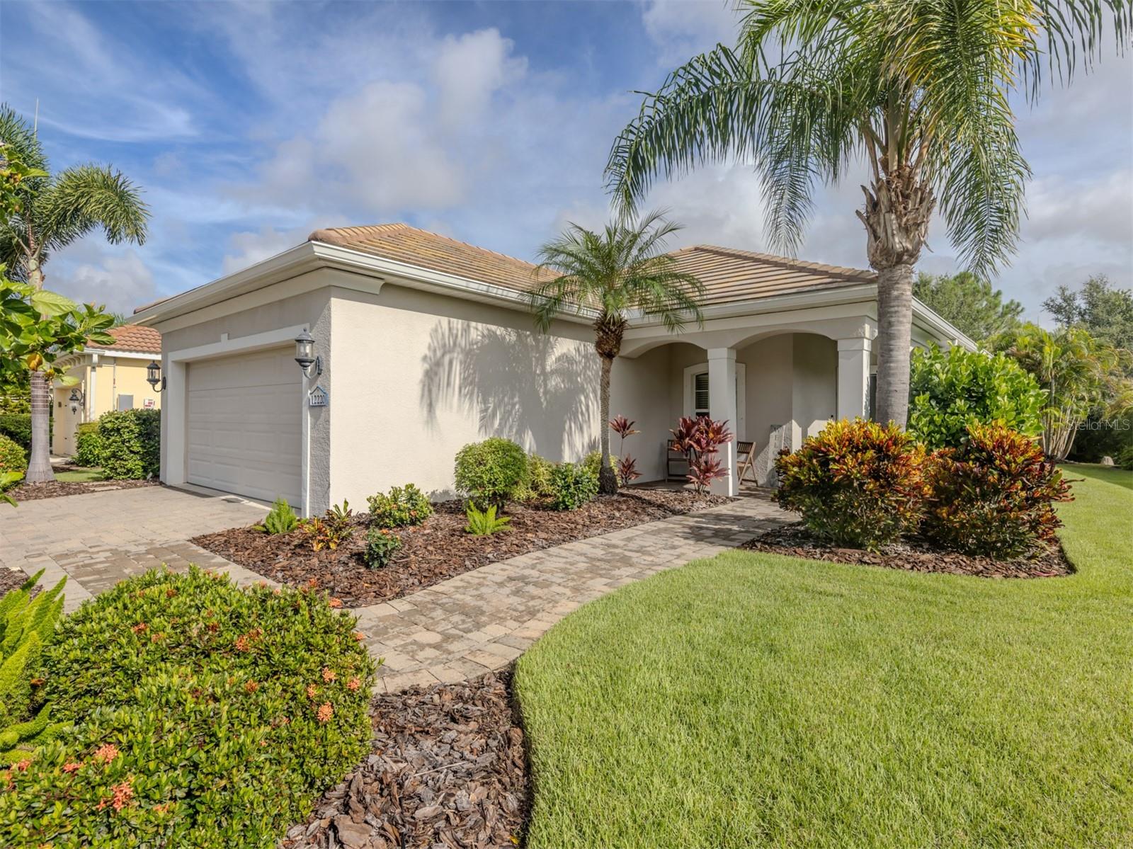This meticulous single-family, three bedroom, two bathroom, pool home is ideally situated on a very special homesite offering the ultimate privacy and tranquility in the front and rear of the home. The rear preserve is beautiful and you have a park-like setting across the street giving you the utmost privacy. In the desirable community of Grand Palm in Venice, this open floor plan provides superb flow and functionality and is thoughtfully designed for those seeking seasonal property, looking to downsize or desiring simplistic living. Lovingly maintained by the current owner, this exceptional home is move-in-ready. Many tasteful and thoughtful enhancements have been made to make this home a cut above the others. The kitchen boasts an abundance of cabinetry, granite counters, ample working space and lighting, stainless appliances and large pantry. The great room and dining area create a comfortable and relaxing atmosphere for easy living and gracious entertaining. Many of the numerous special features include window treatments, fans, crown molding, recess lighting, paver driveway and paver lanai, new water heater and AC, outdoor kitchen and the list goes on. Grand Palm offers a plethora of amenities including full-time activities director, three resort pools, shaded cabanas, splash park, two hot tubs, fitness center, dog park, pickleball, tennis and basketball courts, kayak launch and storage, craft classes, 25-plus miles of walking and biking trails, playgrounds, outdoor picnic pavilion, party events for gatherings and more. Conveniently located to Interstate 75, U.S. 41, A-rated schools, State College of Florida Manatee-Sarasota campus, beaches, golf, fishing, shopping, medical facilities, Houses of Worship, Wellen Park and Atlanta Braves Spring Training at CoolToday Park. Come see this beautiful home today!