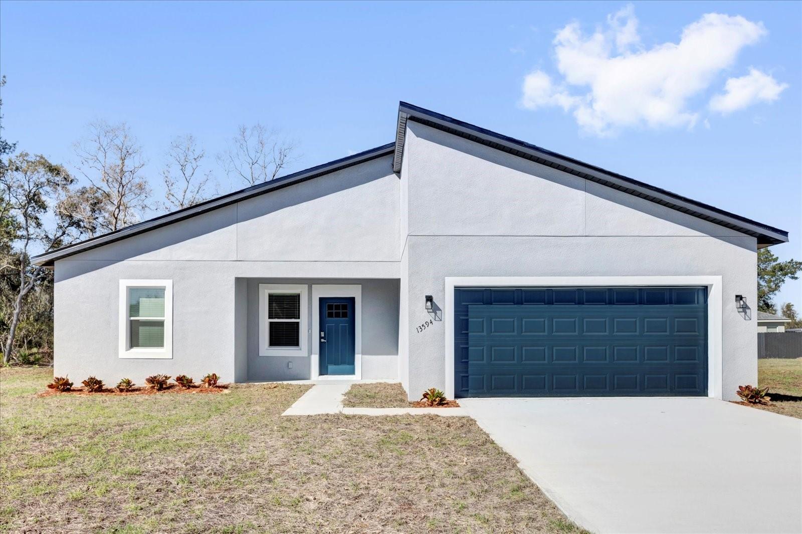 Space, style and a location you'll love at a great price point! Be the first to occupy this new 4/2 with 2-car garage, located on a circle in a quiet neighborhood. As you enter, you will notice that the high ceilings throughout lend to the open feel of the home. The kitchen offers generous lighting, granite counters, upgraded SS appliances and a pantry closet. There is luxury vinyl plank flooring throughout the home, except for the Primary Bathroom. The Primary Bath offers everything you could ask for: Separate room for water closet, a shower, separate soaking tub, higher double vanity with stone counter and lots of space. There are window treatments throughout the home as well. You will love the location of this home in Marion Oaks Unit 1. It is at the front of the subdivision, just two miles from I-75 and less than a mile to the new Aldi’s, only three minutes away! Marion County’s newest high school is under construction in Marion Oaks, just four miles away. All of this, and it is under a 1-year full Builder’s Warranty. Come see this beautiful home in a growing area. You will want to make it yours!