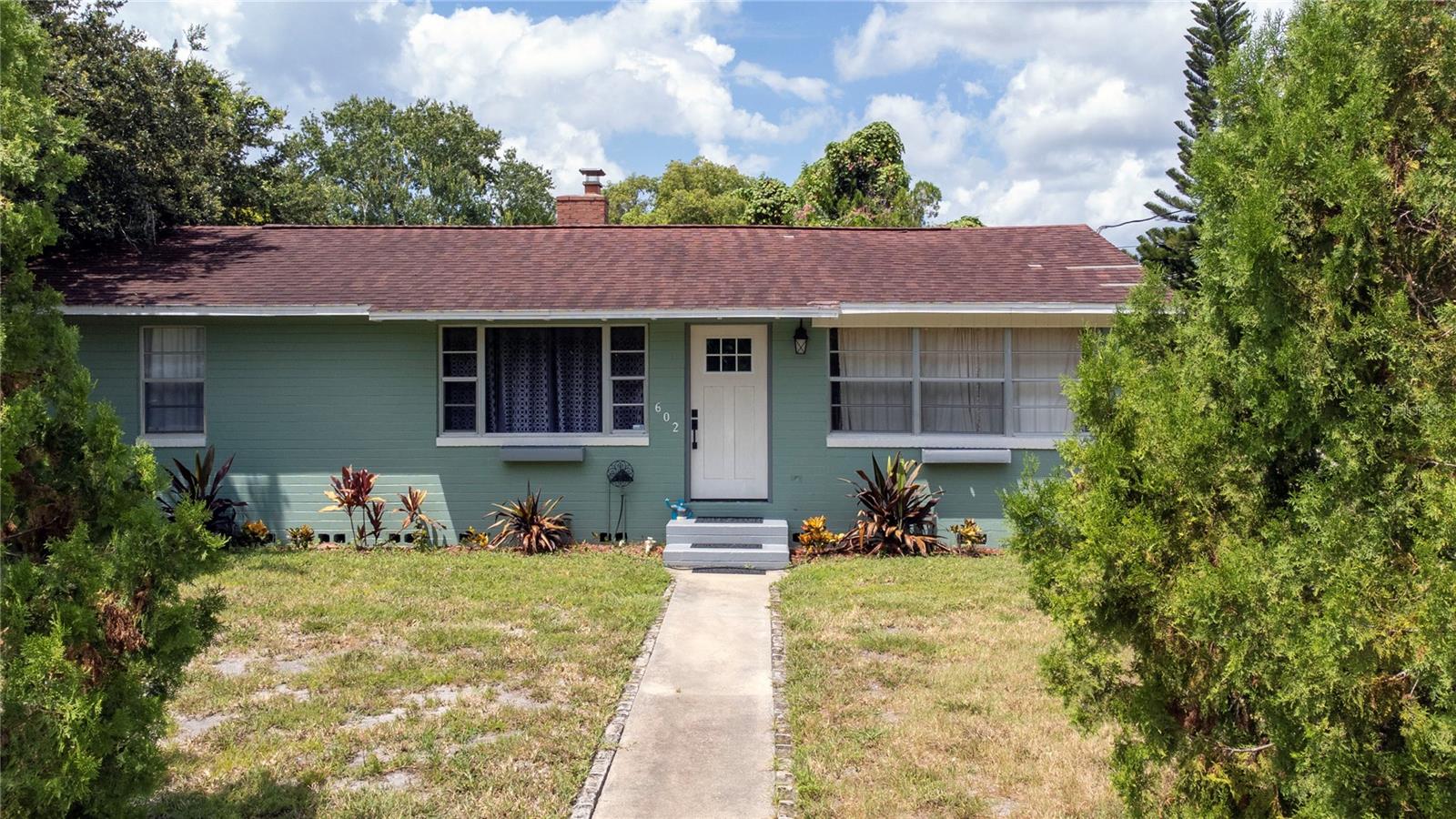 RENOVATED AND CHARMING CONCRETE BLOCK HOME ON A LARGE CORNER LOT! This beautifully updated property is perfect for first-time homebuyers or those seeking the ideal retirement retreat. Light and bright with plenty of windows, the home features a range of renovations and modern touches throughout. Enjoy the outdoors on the spacious, newly refreshed covered patio. The oversized 100' x 122' lot offers plenty of room for RV or boat parking and includes a fully fenced backyard. No HOA! Conveniently located just minutes from the beach, boat launch, parks, schools, shopping, and dining.