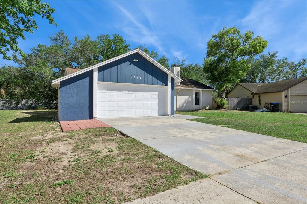 Photo of 6642 Hiawassee Meadows Drive, Orlando, FL 32818 (MLS # O6400351)