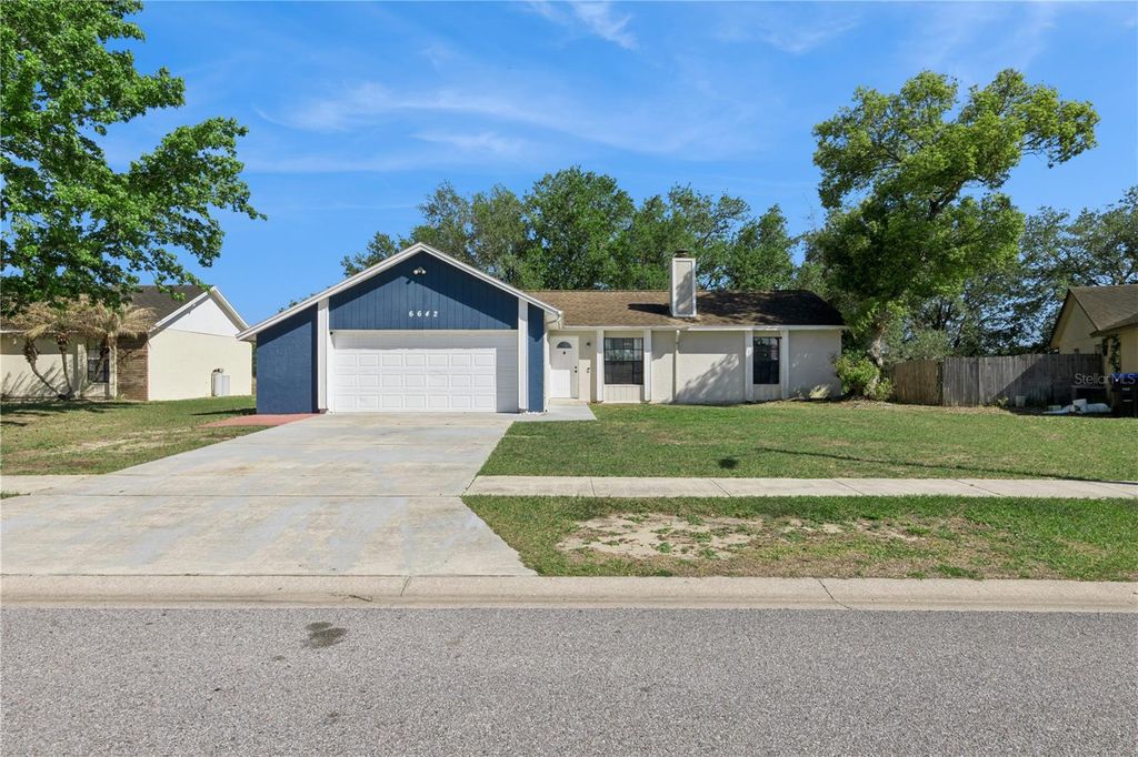 Photo of 6642 Hiawassee Meadows Drive, Orlando, FL 32818 (MLS # O6400351)