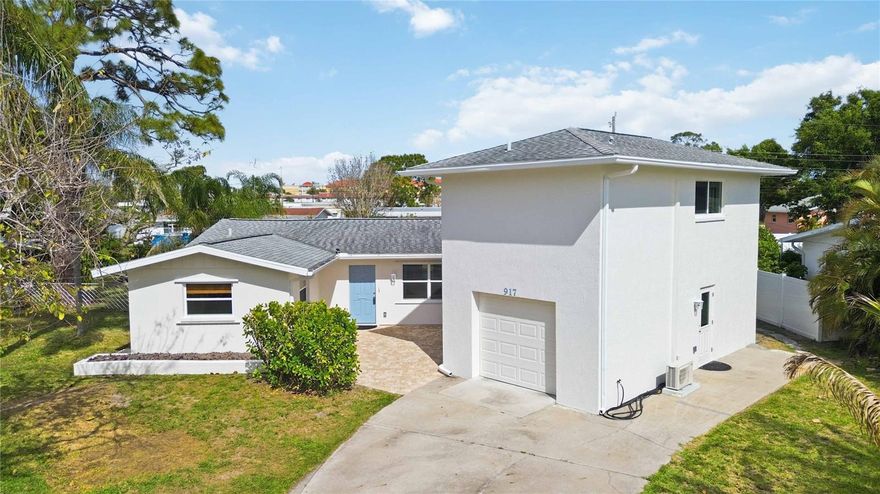 Come enjoy living in paradise on the highly sought-after Island of Venice in this remodeled home with IN-LAW SUITE located just over 2 miles from Venice Beach...this is a "DREAM" location! The spacious in-law suite located above the garage with a separate entrance and features a spacious bedroom complete with a kitchenette, Murphy bed, large walk-in closet, and an ensuite bath with ample cabinets and a shower with a rain head--the new mini-split (2025) has both heating & cooling, and there is a water filtration system along with a 220-volt plug in the kitchenette--the perfect space for family, friends, AirBnb, an office...the opportunities are endless! This home has recently been updated with hurricane impact windows, a freshly painted exterior, luxury vinyl plank flooring throughout, updated lighting & fans, on-demand hot water, a completely remodeled kitchen with ALL the upgrades...and MORE! The “open” floor-plan home invites comfortable and relaxing beach living. Stepping inside the home you're welcomed with a spacious "great room" that is open to the lanai which has both heating and cooling allowing you to easily expand your living space. This area has tile flooring, two sets of pocketing sliding glass doors for privacy from the living area, and french doors leading out to the large lanai...a great bonus space! The stunning kitchen is a chef's dream boasting wood cabinets with soft close drawers, kick-plate lighting, under cabinet lighting & custom motion lighting in the lazy Susan corner cabinets, extra deep drawers and some with custom plate organizers, quartz countertops, glass tile backsplash, a built-in cabinet pantry, plus Whirlpool quality stainless steel appliances, and a top-of-the line JennAir cooktop--an amazing kitchen that you will fall in love with. The dinette features a custom made bar that you can use as a buffet when entertaining guests. 
The primary suite is spacious with dual walk-in closets and attic access in both for additional storage along with an updated ensuite bath that has Cambria quartz countertops, wood cabinets with ample storage space, dual sinks, a private water closet, and an impressive shower with elegant tiled walls, flooring and a shower bench. The second bedroom is roomy with a sizable closet and the same, easy to maintain LVP flooring. The inside utility room doubles as a half bath and located just off the kitchen with access to the garage and inlaw suite, and offers additional storage space with additional cabinetry. The oversized single car garage will accommodate a vehicle and offers additional storage space. 
The expansive lanai area (35’ x 17’) just under 600 sq. ft. is the perfect location to enjoy that morning cup of coffee, relax and read a book or enjoy evening refreshments. The backyard is the perfect place to let the dog run around, while you relax on a chaise lounge and feel the warm Florida sunshine while admiring ALL of the many plants, flowers, and fruit trees for all the nature and bird lovers! Enjoy the added bonuses of this home including a transfer switch to hookup a generator, new sewer lines installed ($15,000), the home was re-pipped, and is located in an  "X flood zone". Located just minutes from the shops and dining on Venice Ave., medical facilities, golfing, and more--this home has been lovingly cared for. Don't miss this RARE OPPORTUNITY to make this one-of-a-kind home in paradise your dream come true!