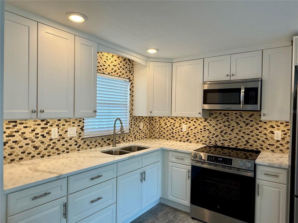 Photo of 4650 Cove Circle #108, St Petersburg, FL 33708 (MLS # TB8477765)