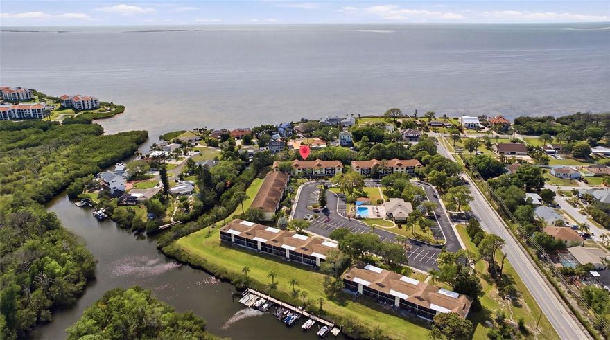 Welcome to effortless waterfront living in the highly sought-after Seascape community of Tarpon Springs. Perfectly positioned along a serene canal with direct access leading to the Gulf of Mexico, this beautifully updated 2-bedroom, 2-bath residence offers a rare combination of lifestyle, comfort, and investment potential. Located on the second floor, this light-filled condo features a desirable split floor plan with soaring vaulted ceilings, creating an open and airy feel throughout. The updated kitchen is both stylish and functional, complete with granite countertops, abundant cabinetry, a breakfast bar, and a wine refrigerator—ideal for entertaining or relaxed coastal living.
The spacious primary suite offers a true retreat with a large walk-in closet and an updated ensuite bath featuring dual sinks, granite countertops, and a step-in shower. A generously sized guest bedroom and updated second bath provide comfort and privacy for visitors.
Step outside to your expansive screened and weatherized balcony, extending from the living area to the primary suite, where tranquil canal views create the perfect backdrop for morning coffee or evening unwinding. Offered fully furnished, this home is truly move-in ready—making it an exceptional opportunity for snowbirds or those seeking a seamless second-home experience. Adding even more value, a lease is already in place through November 2026, providing immediate and reliable rental income for investors or buyers looking to secure their future coastal retreat while generating returns in the interim. Residents of Seascape enjoy a well-maintained waterfront community featuring a heated pool, clubhouse, fitness room, kayak storage, and more—all with a low HOA that covers cable, internet, water, exterior maintenance, and insurance. With only 68 units, this community offers both privacy and a true neighborhood feel. Ideally located just minutes from Fred Howard Park, Sunset Beach, and the world-famous Tarpon Springs Sponge Docks, you’ll enjoy easy access to beaches, dining, shopping, and the charm that makes Tarpon Springs one of Florida’s most beloved coastal towns. Whether you're looking for a winter escape, a low-maintenance waterfront lifestyle, or a smart investment with built-in income, this is a rare opportunity to have it all.