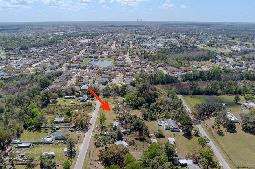This parcel of land is a half acre in size located in a fast developing area of east Orlando. RT2 zoning allows mobile home or a newly constructed home. Zoning does not allow living in RVs or campers. This neighborhood has a rural feel despite being located in Orlando. With a half-acre of land you won’t feel like you are on top of your neighbor. Property has paved road access, power lines are running down the street, septic system is required and a well needs to be drilled for water. Property is located right off highway 50 with quick access to everywhere in central Florida. The property is 10 minutes from UCF which is one of the largest universities in the United States, 20 minutes from Downtown Orlando where you can watch Orlando Magic games, 30 minutes to Winter Park where you can enjoy fine dining shopping and the chain of lakes for boating, 25 minutes to Lake Nona where medical city is located, 50 minutes to Cocoa Beach for great surfing, 30 minutes from the attractions at Disney Seaworld Universal and 25 minutes to the airport.