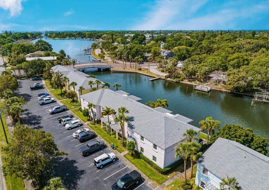 Welcome to Paradise! Waterside Condos North Village is one of St. Petersburg’s best-kept waterfront secrets. This beautifully updated 2-bedroom, 2-bathroom waterfront condo comes fully furnished — including housewares — and is truly move-in ready. The home features custom espresso beveled kitchen cabinetry, granite countertops, stainless steel appliances, full-size stackable washer and dryer, high ceilings, tile flooring throughout, and waterproof luxury vinyl plank flooring in the bedrooms. Located on the second floor, the covered private balcony overlooks the tranquil bayou — the perfect spot for morning coffee or evening sunsets. Rent includes furniture, housewares, cable TV, electricity, internet, water, sewer, trash, and parking. From the moment you enter the gated community of Waterside at Coquina Key, you’ll feel the charm of a friendly, resort-style neighborhood with picturesque views of Tampa Bay, Bird Island, and the Sunshine Skyway Bridge. Resort-style amenities include  three oversized heated swimming pools, two spas, a Yacht Club with restaurant and bar, banquet space, library, and billiards room, state-of-the-art fitness centers with sauna and cardio rooms, tennis, basketball, volleyball, and pickleball courts, fishing piers, kayak launch and storage, boat parking, bicycle racks, three miles of scenic seawall and walking paths, electric vehicle charging stations, and a pet-friendly environment. Conveniently located just minutes from Downtown St. Petersburg, shopping, dining, marinas, Gulf beaches, Eckerd College, Stetson Law School, Fort De Soto Park, the Dali Museum, Tropicana Field, and easy access to I-275 for Tampa, Bradenton, and Sarasota.