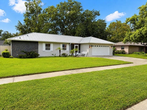 Photo of 7640 Village Green Dr, Winter Park, FL 32792 (MLS # O6431278)
