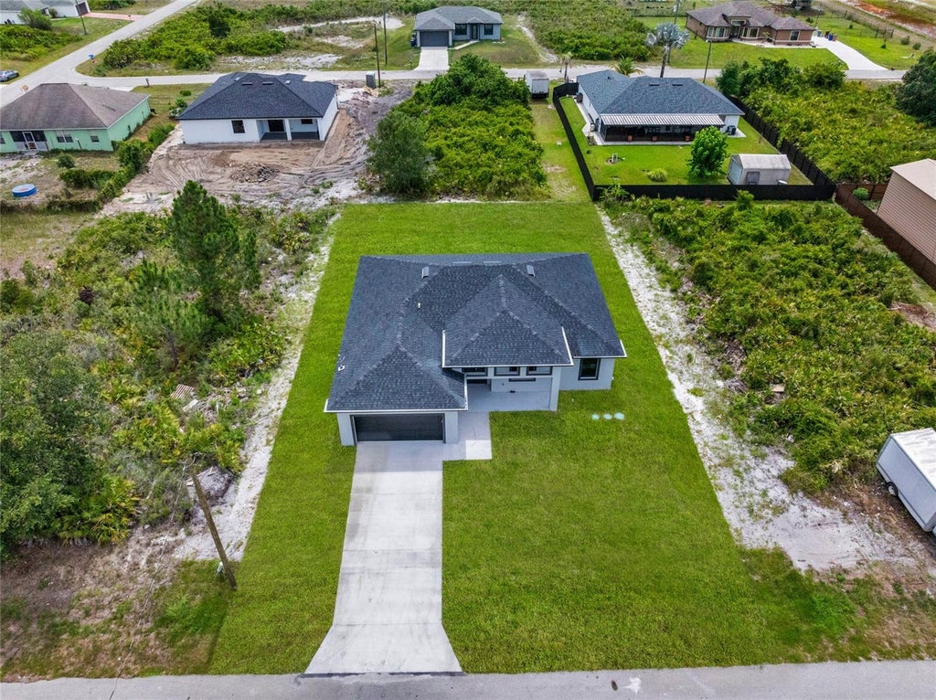 Photo of 4626 Elaine Avenue N, Lehigh Acres, FL 33971 (MLS # O6452442)