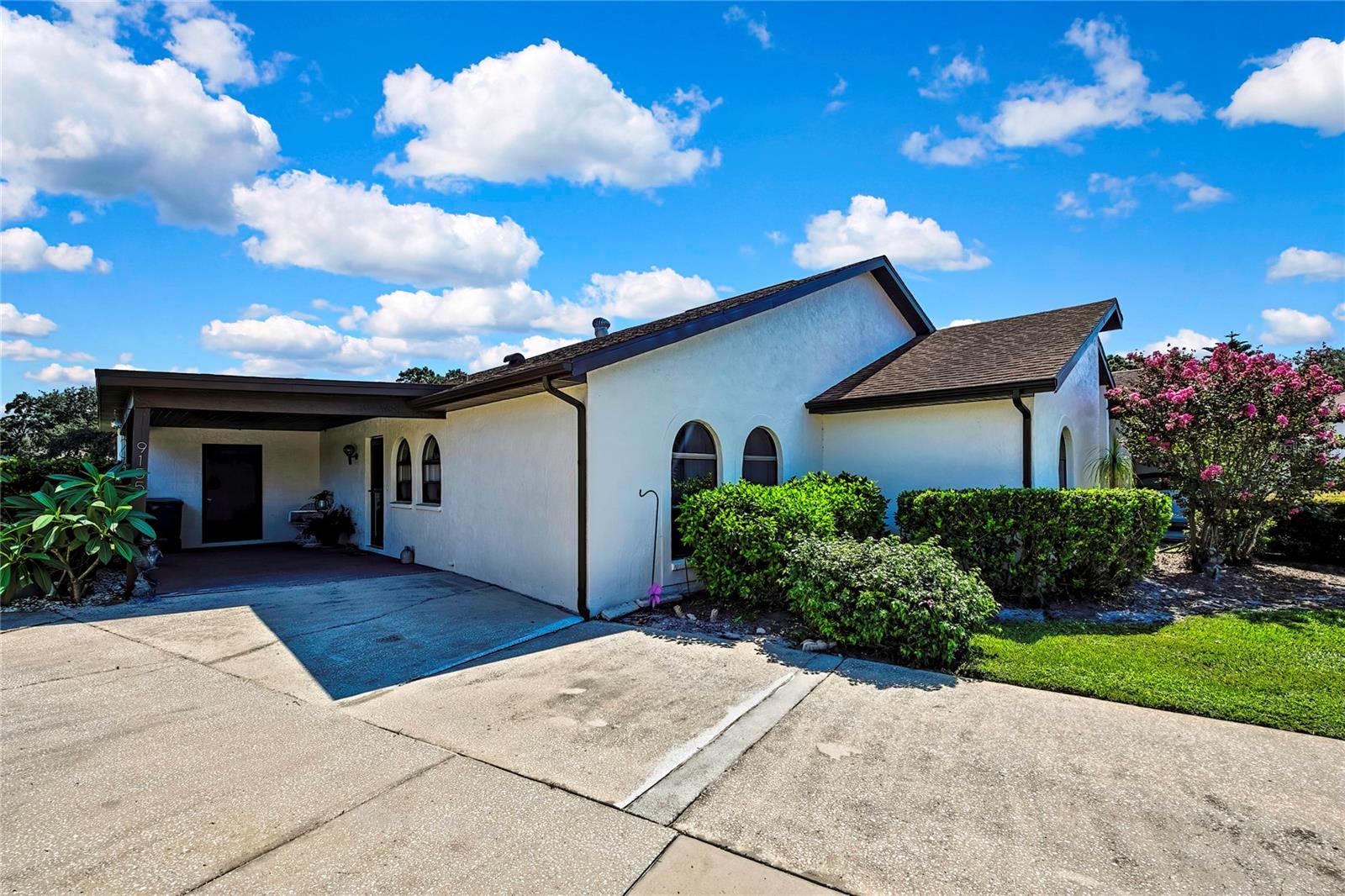 What a Lovely Property to Call Home! Welcome into this 3 Bedroom 2 Bath end unit Home. Nice size driveway for several cars plus a spacious Carport with enough room for your car and some outside furniture to sit and enjoy your front view. Sitting on a cul-de-sac in this 55 plus community of 31 homes in the Heather Sound. The Sounds community pool sits in the center of it all. Perfect location to your home and perfect to relax with a book or have social time with your neighbors! Or relax out back with your pond view in your heated and air enclosed Florida Room. Well maintained home with HVAC unit replaced in 2023. All appliances remain as well as the washer and dryer. The kitchen is appointed with several cabinets for storage as well as a pantry and a Breakfast Bar. Vaulted ceiling in your Family Room and Breakfast Nook area. Most floors are finished in a vinyl plank. Spacious Master ensuite with double closets. The 2 additional Bedrooms are great for your guest, office or den! This deed restricted Hoa community includes road Maintenace, guard greeter at entrance, Community pool and Clubhouse with a small Library, lawn care and irrigation, plus exterior paint of your home! This is a golf course community for an extra cost. Close to shopping, restaurants, hospital, pharmacies and the Beach at Pine Island. X flood zone. Around 75 miles to Disney/Universal and 90 minutes to the famous Clearwater Beach. Great home for snowbirds, downsizing, or 2nd Home. Message us today for your private showing. This 1 wont last!