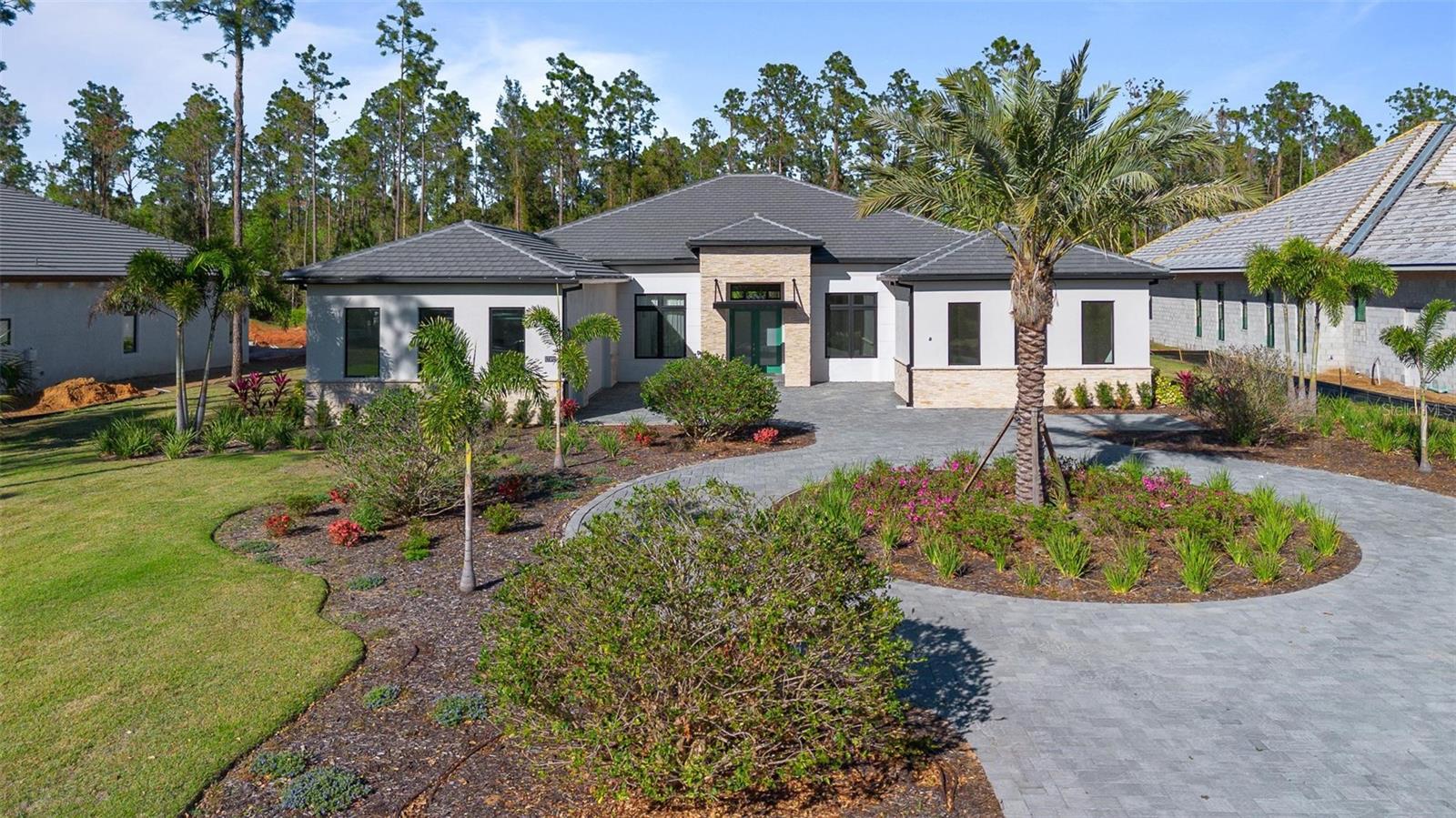 Discover your dream home in the prestigious Bella Collina community! This expansive Toll Brothers Cabris model offers an abundance of upgrades and a thoughtful open-concept design, perfect for modern living and entertaining.
As you step through the inviting double-door entry, you are welcomed by a grand foyer that leads to an expansive great room, casual dining area, and a desirable covered lanai—ideal for hosting gatherings. The gourmet kitchen is a chef’s delight, featuring a large center island with a breakfast bar, ample counter and cabinet space, and a spacious walk-in pantry.
Retreat to the private primary bedroom suite, complete with dual walk-in closets and a deluxe bath that offers dual vanities, a luxurious soaking tub, and a stylish shower. The home also includes secluded secondary bedrooms, each with walk-in closets, two sharing a bath with separate dual vanity areas, and two featuring private baths for added convenience.
Need extra space? The detached large room with a bathroom can easily serve as a fifth bedroom or an entertainment space. Add to this a generous office and a well-designed workspace off the kitchen, offering endless versatility for work and leisure.
With a 3-car garage and a large outdoor living room, this home combines functionality with elegance. Bella Collina elevates your lifestyle with unparalleled amenities, including a guard-gated entrance, a Sir Nick Faldo-designed golf course, a stunning 75,000-square-foot Tuscan-style clubhouse with dining options, a spa, a fitness center, tennis courts, and a large swimming pool.
Ideally located in Montverde, you'll be close to major theme parks, Florida's beautiful beaches, the popular West Orange Trail, and the vibrant downtown areas of Clermont and Winter Garden—complete with unique shopping, dining, and craft breweries. Plus, you're just minutes away from the prestigious Montverde Academy.
Don’t miss this incredible opportunity to make this luxurious home your own—schedule your visit today!