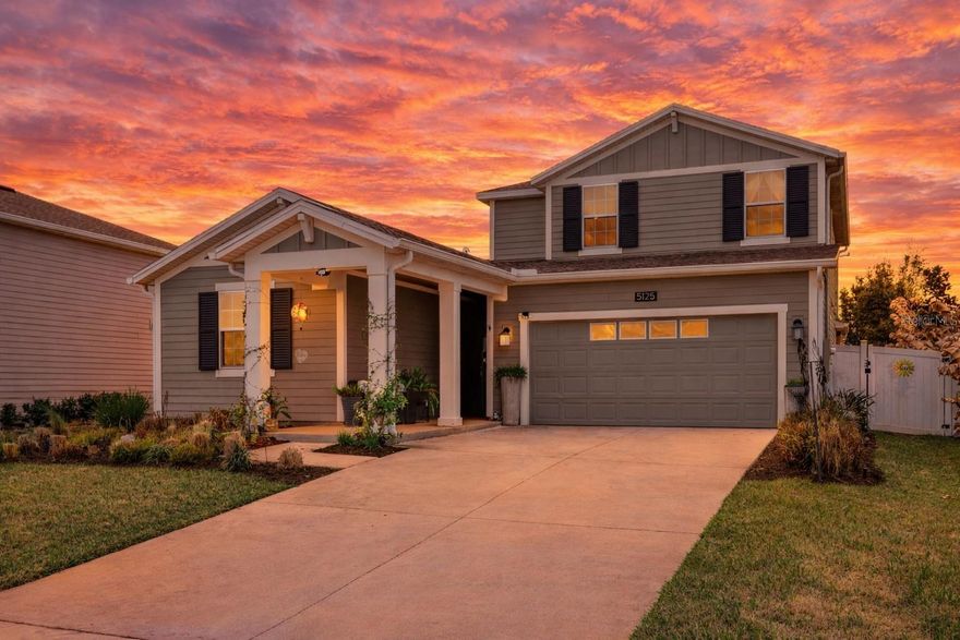 This MOVE-IN READY 5 BEDROOM, 4 BATH POOL HOME offers the highly desirable NEXT GEN floor plan, perfect for MULTI-GENERATIONAL LIVING or a private IN-LAW SUITE with its own PRIVATE EXTERIOR ENTRANCE, full kitchen, living room, bedroom, and full bathroom—ideal for extended family, guests, or flexible living arrangements. The PRIMARY SUITE is conveniently located on the FIRST FLOOR, along with an additional downstairs guest bedroom with its own full bath, making it perfect for a HOME OFFICE or private guest retreat. Upstairs you’ll find a spacious LOFT/BONUS ROOM plus two additional bedrooms and a full bathroom. The OPEN CONCEPT layout is enhanced by TILE FLOORING, QUARTZ COUNTERTOPS, 42-INCH CABINETS, CROWN MOLDING, and abundant natural light. Step outside to your private backyard oasis featuring a 24 x 11 POOL installed in 2022 with a beautiful WATERFALL FEATURE—perfect for enjoying Florida outdoor living year-round. Fully fenced for privacy, security, and peace of mind! The home is constructed with durable LP SmartSide siding, known for its IMPACT RESISTANCE, moisture protection, termite resistance, and LOW MAINTENANCE durability—ideal for Florida’s climate. The solar panels make this better than new home energy efficient. Stoneybrook Hills offers RESORT-STYLE AMENITIES including a community pool, splash pad, clubhouse, fitness center with child play area, basketball and tennis courts, greenspace, and 24-hour guard-gated security. Conveniently located near shopping, dining, and everyday essentials, and just 4 miles from historic downtown Mount Dora, known for its waterfront views, boutique shopping, dining, and year-round festivals. If you are searching for HOMES FOR SALE IN MOUNT DORA FL, a POOL HOME, or a NEXT GEN HOME WITH IN-LAW SUITE, this exceptional property checks every box.