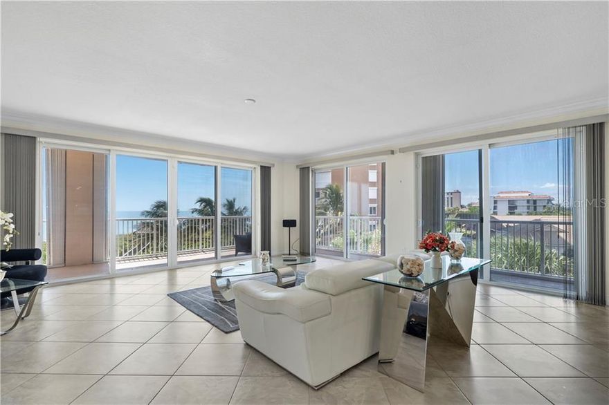 Oceanique Luxury Oceanfront Corner Condo on Hutchinson Island has 1 car garage & 3 balconies adding 413SF of living space. New triple ply impact hurricane windows & sliding glass doors thruout plus electric & manual hurricane shutters. Entertain easily w/ subzero 2 zone wine cooler & beverage refrigerator, induction stove, convection micro & oven, dryer, new washing machine, new 5-ton AC. Amenities: Sweeping views of ocean, easy access to pool, beach, clubroom, gym, billiard room, pickleball & tennis court, firepit, outdoor kitchen BBQ & 2 EV Chargers.Resort style living in paradise awaits you