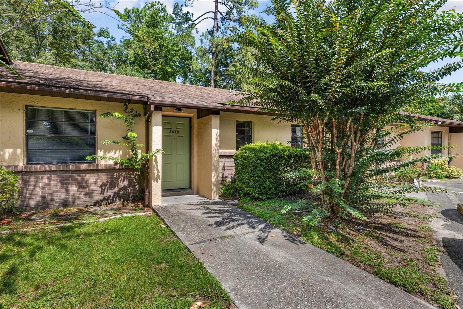 Charming 2 bedroom 2 bathroom condo in Palmetto Villas. TWO Assigned Parking Spots. No Carpet. Tile throughout. The unit also includes an outside storage/ laundry room with washer and dryer connections. WATER and EXTERIOR GROUND CARE included in Monthly HOA. Centrally located in Gainesville, Palmetto Villas offers unmatched convenience with a few mins of walking distance to Bus Stop. Minutes away from the University of Florida, Santa Fe College, Shands Hospital, shopping centers, restaurants, Publix, and downtown Gainesville. Whether you're looking for a primary residence or an income-producing property, this condo checks all the boxes. Schedule your showing today!