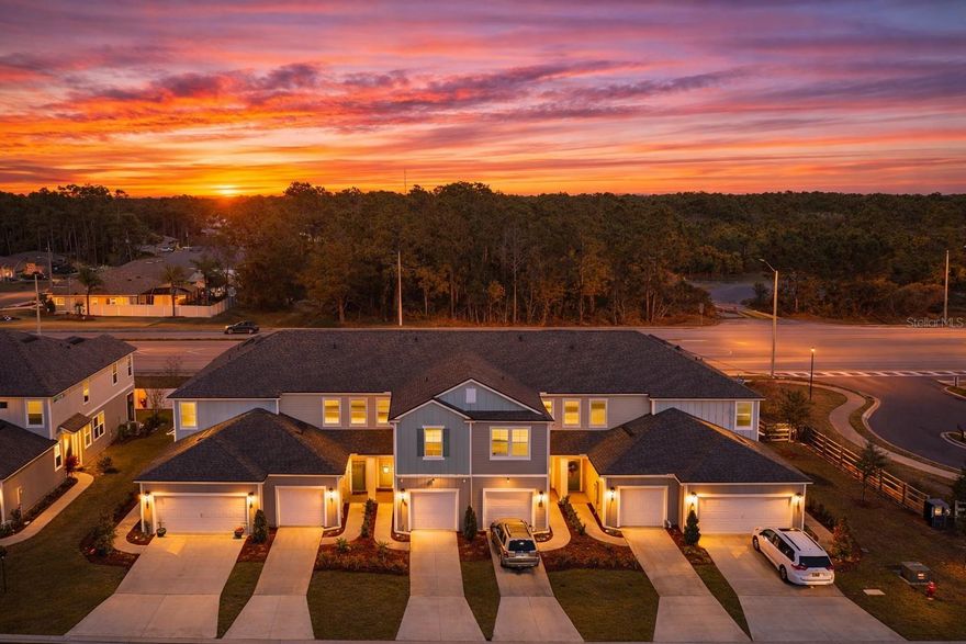 Welcome to The Trails, a gated community with a great vibe. This Keaton model townhome by DR Horton was built in 2023 and feels practically brand new. The home offers a modern style with white cabinetry, granite countertops, stainless Whirlpool appliances, upgraded light fixtures, and a freshly repainted interior. The first floor is tiled throughout, while the second floor features carpet for added comfort. Upstairs, the primary suite includes an en suite bathroom with dual sinks and a walk-in shower. Two additional bedrooms and a full guest bath provide flexible living space, while a half bath is located on the main level. All bedrooms and the laundry room are upstairs for everyday convenience. Enjoy the screened-in lanai, perfect for relaxing outdoors. This side-unit features a private left-hand entry, a two-car garage, and finished interior paint. Enjoy shockingly low monthly HOA fees, gated entry, a community playground, full irrigation, and professionally maintained landscaping. Conveniently located near I-95 and US-1 with easy access to Jacksonville, St. Augustine, Daytona Beach, and Gainesville. Schedule your private showing beginning February 2nd.