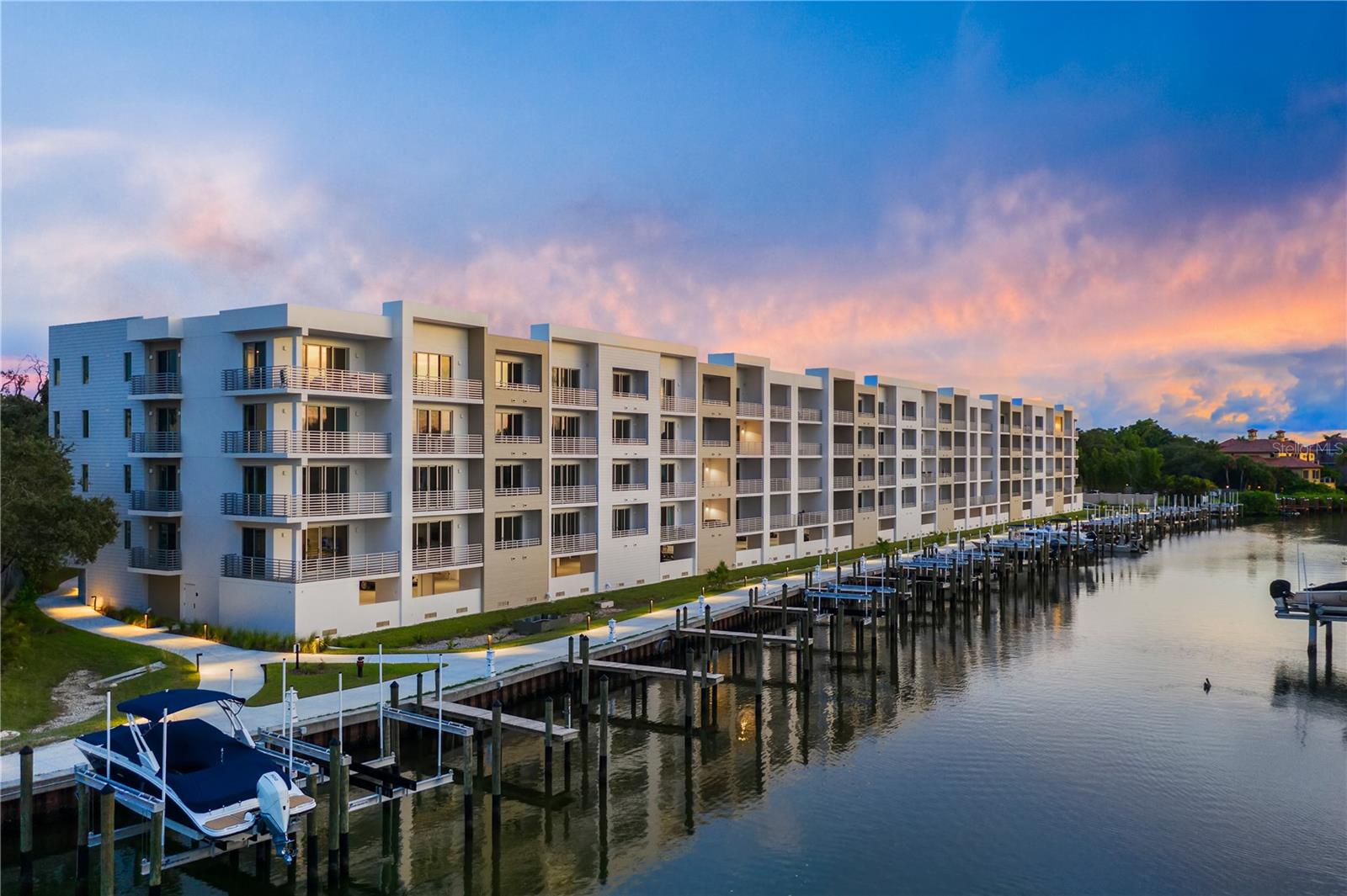 A desirable piece of paradise awaits in The Strand. Encompassing one-bedroom, one-and-a-half baths and nearly 1,000 square feet of living space, this four-floor residence is ideal for those who seek an enviable Florida lifestyle. The interior features a large, open kitchen with quartz countertops, stainless steel appliances and backsplash, welcoming any culinary connoisseur. Be captivated by the unobstructed water views from the private terrace, complete with a sleek, contemporary furniture design. For convenience, a deeded storage unit, laundry room and under-building parking are included with this home. A private and gated community, The Strand invites its residents to enjoy fun in the sun with a resort-style pool and spa, dog park, boardwalk, kayak and paddleboard launch, while the interior amenities include a fitness center and clubroom. With proximity to the arts, eclectic dining and shopping, the beautiful beaches and all Sarasota has to offer, this little gem is one of a kind.