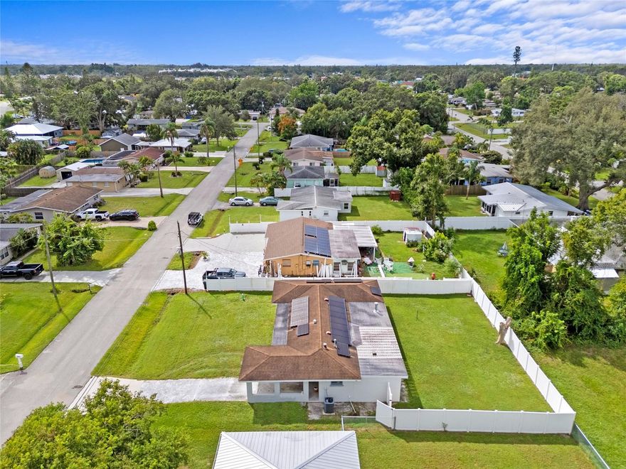 Experience the allure of this charming home—a true treasure that’s perfect for first-time buyers, seasonal snowbirds in search of a serene escape, or astute investors hunting for an exceptional opportunity. The inviting living room serves as the heart of this residence, effortlessly connecting to the dining area and kitchen, creating an ideal environment for entertaining friends and crafting unforgettable memories. 
On one side, you’ll find two generously sized bedrooms, thoughtfully separated by a beautifully designed bathroom featuring a convenient tub and shower combo. Open the sliding doors from the living room, and step into a peaceful lanai adorned with an outdoor fireplace and an enchanting pergola—perfect for hosting gatherings or savoring quiet moments immersed in nature. Freshly updated with new paint in 2023 inside and 2024 outside, this home radiates a modern, welcoming aura. Enjoy the significant savings from fully paid-off solar panels that ensure remarkably low electric bills! Relish the freedom of having no HOA fees or deed restrictions, all while being perfectly situated near top-rated schools, vibrant dining options, shopping, and just a short drive from the bustling downtown Sarasota and its stunning white sandy beaches. This is the dream home you’ve been waiting for! Seize this incredible opportunity—schedule your showing today and start living the Florida lifestyle you’ve always desired!