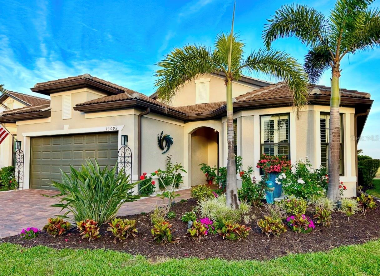 Pride of Ownership lives here! This Divosta Summerwood Model on a PREMIUM lot, with open Lake and Preserve views is a "one of a kind" custom, meticulously kept home, with an open concept floor plan. The views abound from within the home and from the spacious lanai. The pool is situated on the east side for optimum sun exposure in the morning and early afternoon, leaving you with ideal cooler/shaded conditions in the later afternoon. This truly could be your private oasis, with a covered patio, a Panoramic "Clear View" Screen for unobstructed views of the lake and preserve, a Heated SALTWATER POOL and Spa, A custom 2 person Sauna to name a few. Updates, upgrades and custom personal touches set this home apart from the rest in this community and include some of the following: Quartz Countertops, New Stainless-Steel Appliances, New drop-down pendants, upgraded backsplash, and custom backsplash, and Breakfast Bar. The living area has been upgraded with new enhanced lighting and custom in-lays in the ceiling of the living room and bonus room. New Interior and Exterior Paint, ceiling fans, recessed lighting, ship-lap accents, upgraded custom laundry room with extra cabinet storage and a utility sink. Nighttime exterior lighting and the lighted landscape features will enchant you. Upgraded garage with 4 ft expansion for the golf cart. Drive your golf carts over to the Amenity centers and the Wellen Park master-planned community nearby. Here at Islandwalk near WELLEN PARK it truly is a lifestyle with a 14,000-square-foot Resort Center. In the clubhouse, residents can utilize the state-of-the-art fitness center with state-of-the-art cardiovascular and weight-training equipment, a movement studio, and a therapy room, activities room, the gathering room, or the library. The amenities include a resort-style pool, a lap pool, a whirlpool spa, eight lighted Har-Tru tennis courts, bocce ball courts, pickleball courts, barbecue area, lakeside gazebo, walking and biking trails, activity rooms, a ballroom for large social events, and an outdoor barbecue area with a fire pit. Not to mention Wellen Park master-planned community with a town hall, on-site retail options, a food truck park, a canoe house and kayak rentals, as well as an 80-acre lake.