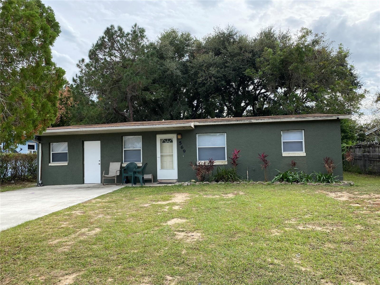 This charming 3-bedroom, 1 bath single-family home is ideally situated for convenience and easy access to everyday essentials. Located just off Highway 27, you'll find grocery stores, dining options, and the turnpike right around the corner, making commuting and running errands a breeze. As you step inside, the first room on the left offers a versatile bonus space-perfect for a home office, study, or even a cozy den to relax in. The spacious backyard provides ample room for outdoor activities, gardening, or simply unwinding in a private setting. Whether you're looking for a family home or a peaceful retreat with quick access to the heart of town, this property offers both comfort and practicality.