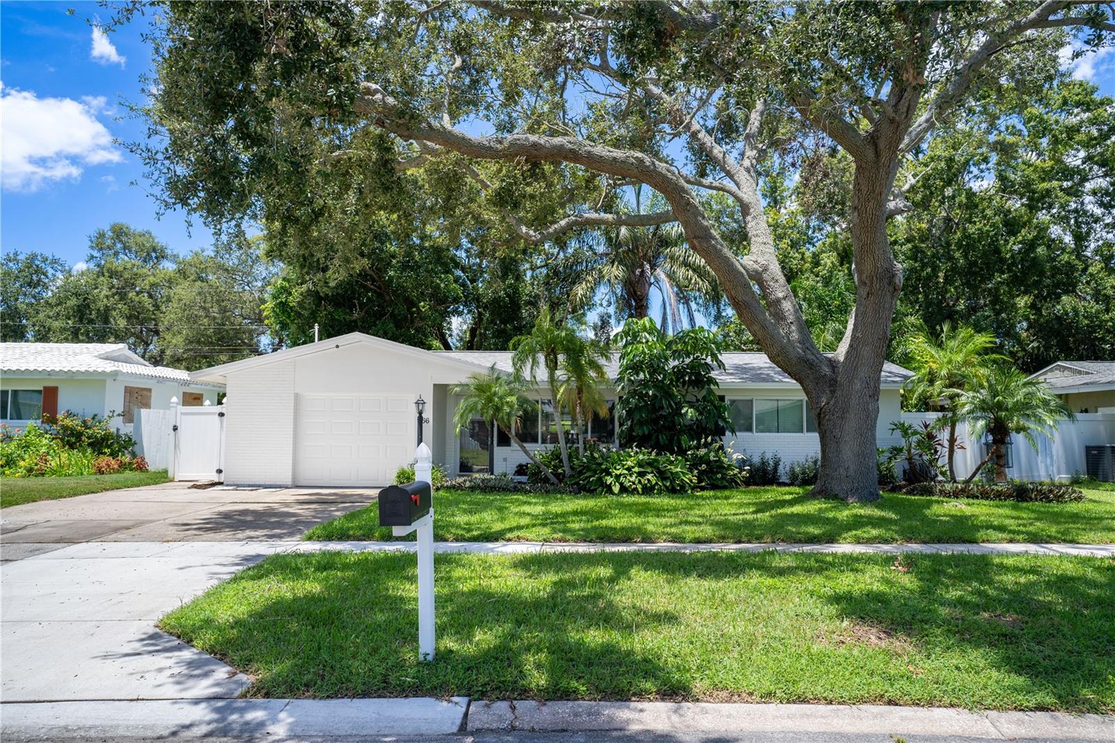 Welcome to this move-in ready 3-bedroom, 1.5-bathroom home nestled in a quiet, well-established neighborhood. With great curb appeal, lush landscaping, and a canopy of shade , this home offers the perfect blend of comfort, functionality, and classic charm.
This home features brand new exterior paint, a newer roof (2021) and hurricane impact windows and doors. Step inside to find a bright and airy interior featuring clean, vinyl plank flooring and neutral paint tones throughout. The main living area includes a versatile dining or workspace area with ample natural light from wide windows. The spacious kitchen features stainless steel appliances and main living areas flow easily for both everyday living and entertaining. Each of the three bedrooms offers generous space and storage while the main bathroom offers double sinks, a shower/tub combo and plenty of space. The half bathroom in the garage includes a shower for convenience. The back room has been converted into a fully functional bedroom with a closet and it's own AC unit - adding 180 square feet of living space! Additional highlights include a one-car garage, a fully fenced backyard with tropical landscaping, and plenty of outdoor space for gardening, pets, or play. Located close to local schools, parks, shopping, and dining, this home combines suburban tranquility with urban accessibility. Don’t miss the opportunity to own a great home at a great price near the Largo/Clearwater border – schedule your private showing today!