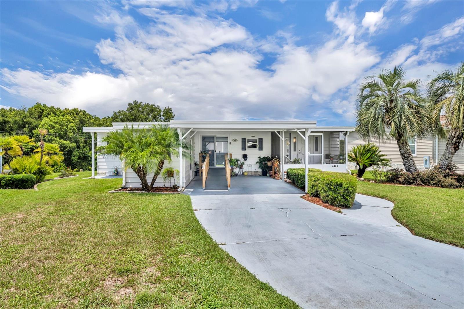 Not far from the busyness and excitement of Metro Orlando and just a few miles from the quaint Mount Dora, you'll find the Guard Gated, Security Patrolled, meticulously maintained 55+ Manufactured Home community of Zellwood Station. Come fall in love with not only this exclusive community, you will want this tastefully updated, ADA access home you'll find situated on what is know as a Greenbelt lot with nature for your rear neighbor as your abode. Lush greenery and a peaceful pond are your view as you relax in the climate controlled Florida Room. Zellwood Station provides activities for all intersrests. A few of the amenities include a Clubhouse, four swimming pools, water exercise, 72 holes of golf, pickleball, tennis courts. Whether you choose to take advantage of activities or to relax in this peaceful community, you can enjoy food and drink afterward at the Whistle Stop Restaraunt and Lounge. Contact your agent for your tour af this intriguing community and this beatiful, well appointed home!
